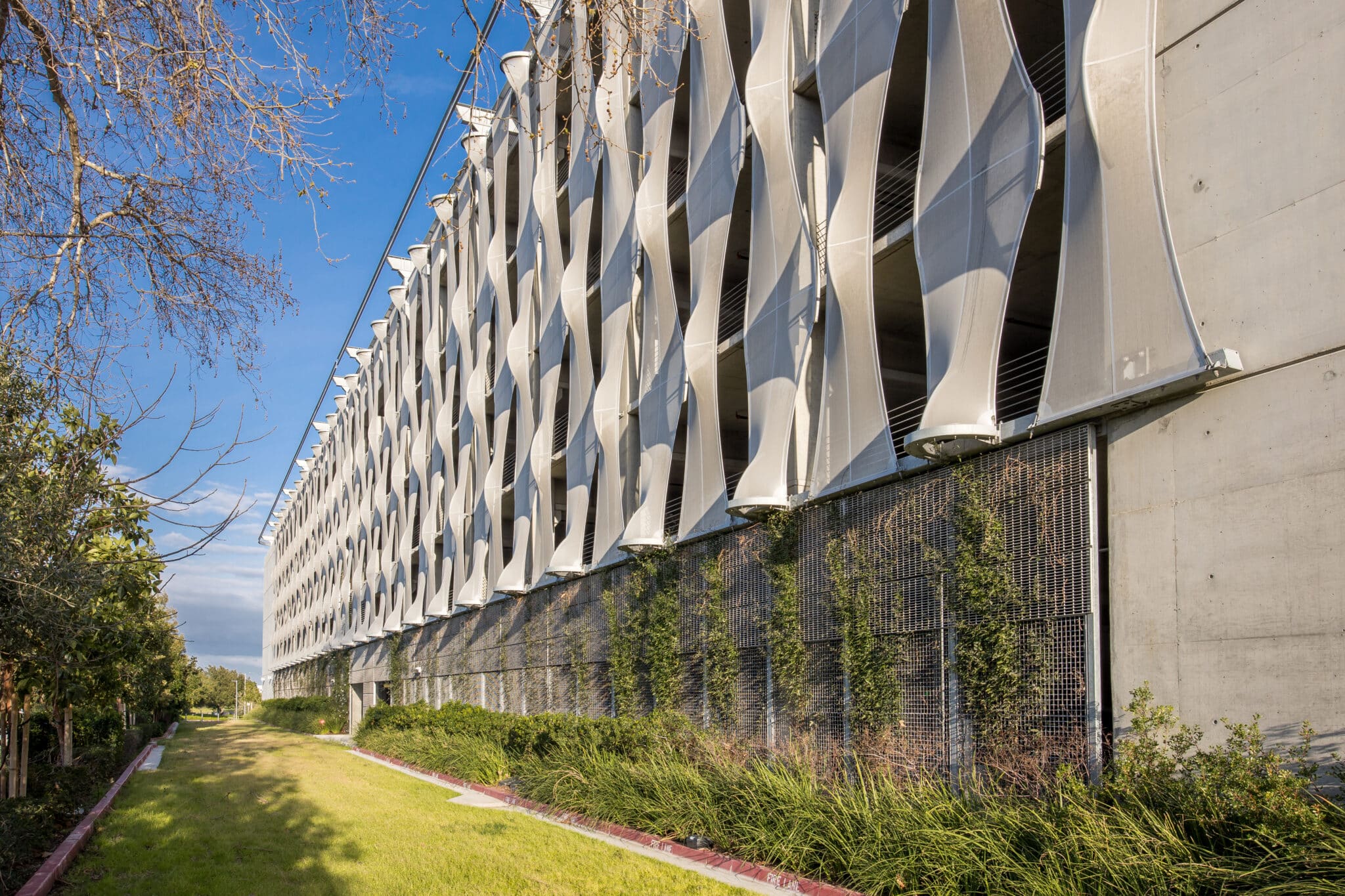 A view of the facade from the sidewalk, showcasing how it elevates the surrounding area.
