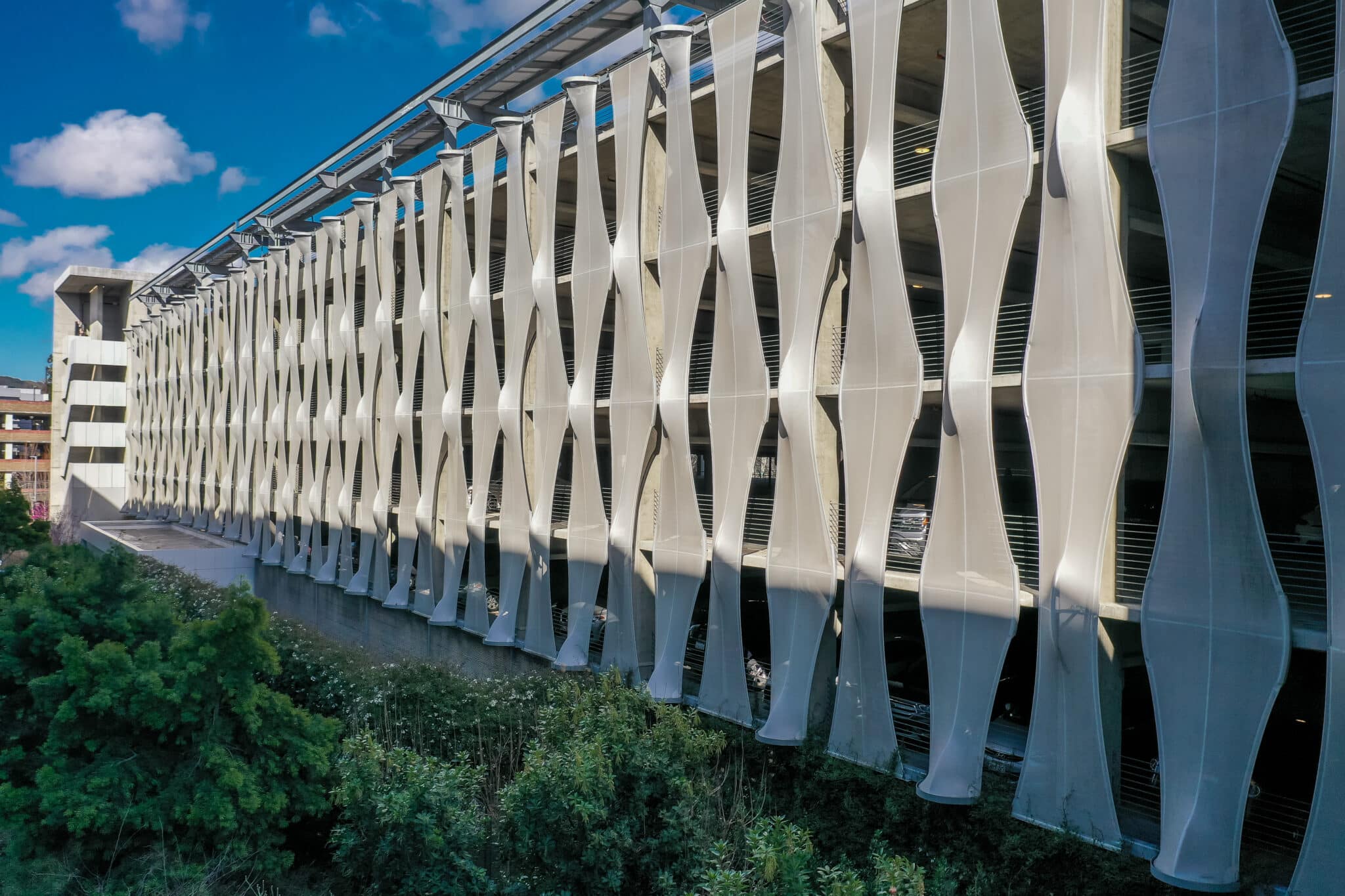 A close up of the tree dimensional facades that sticks in and out to mimic a woven like pattern.