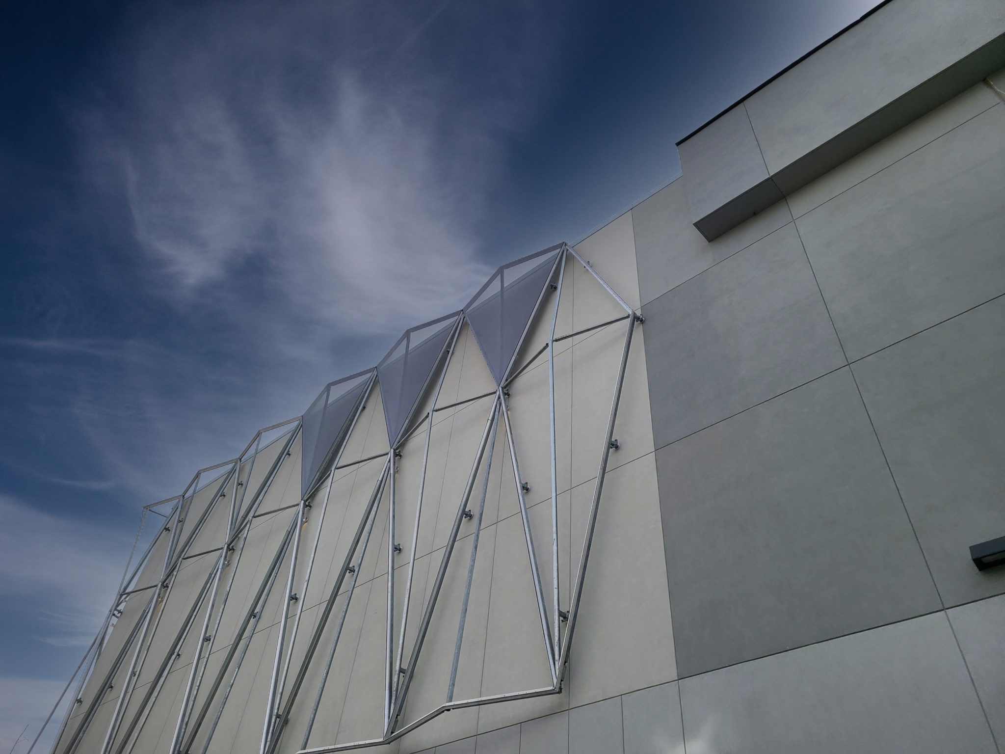 An installation image showing the bare steel structure underneath the facade.