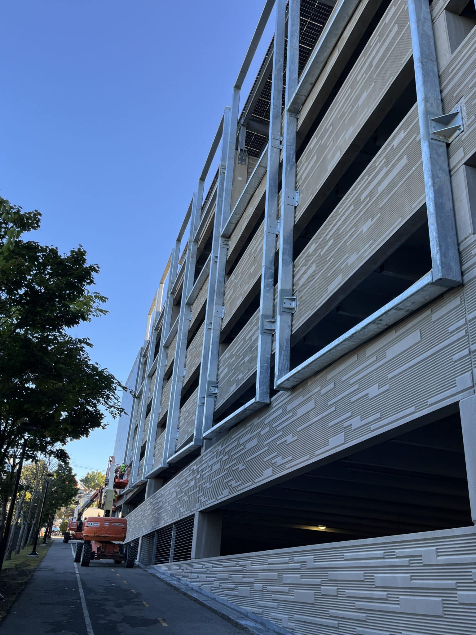 A process photo of the empty steel frames before the tensile facade was installed.