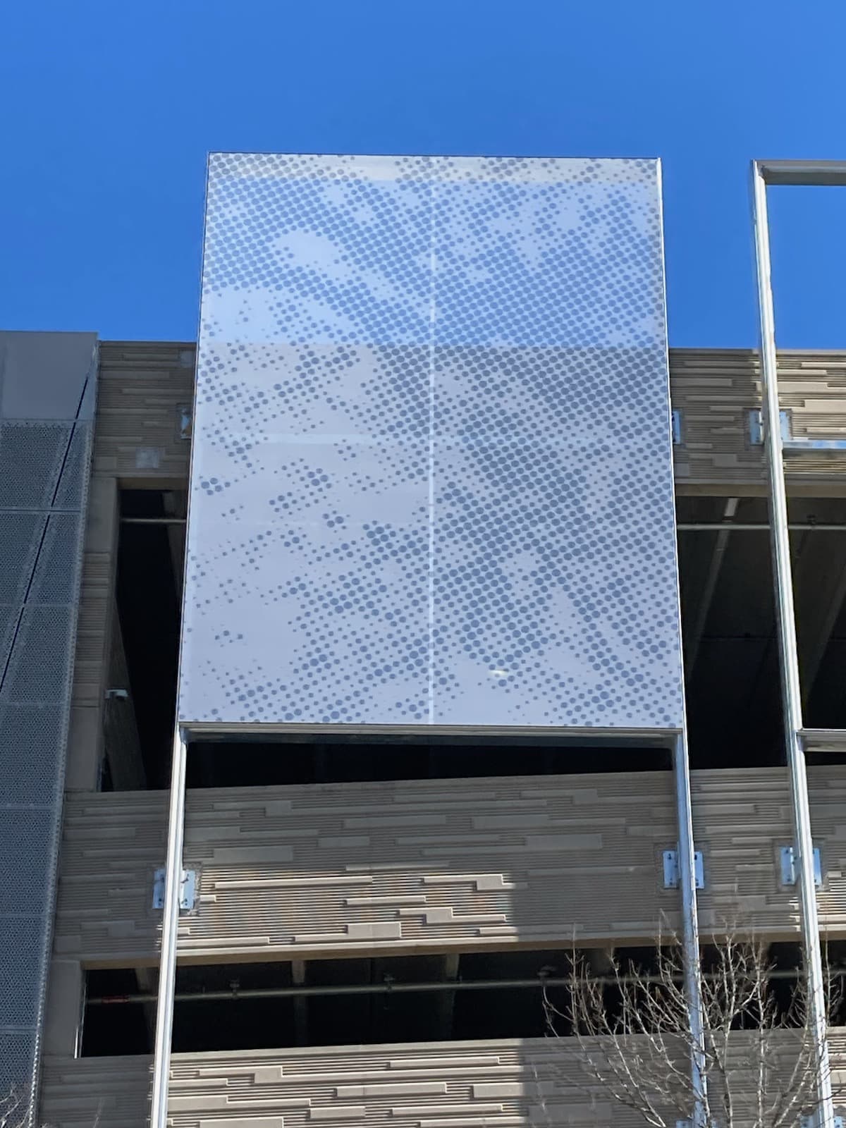 A close up of the facade panels being installed.