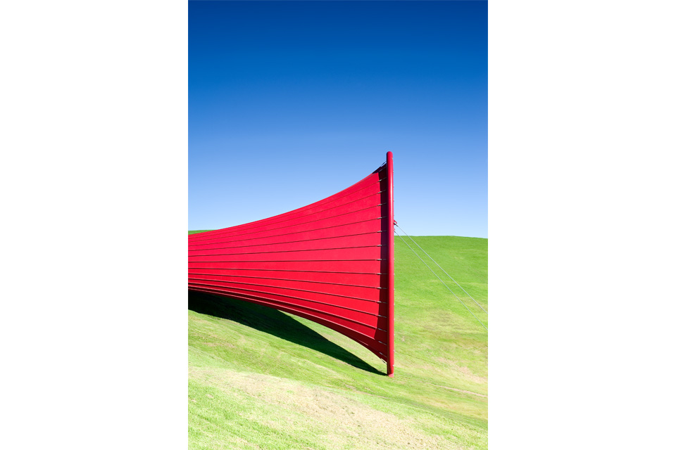 A side profile view of the sculpture that sits on rolling planes.