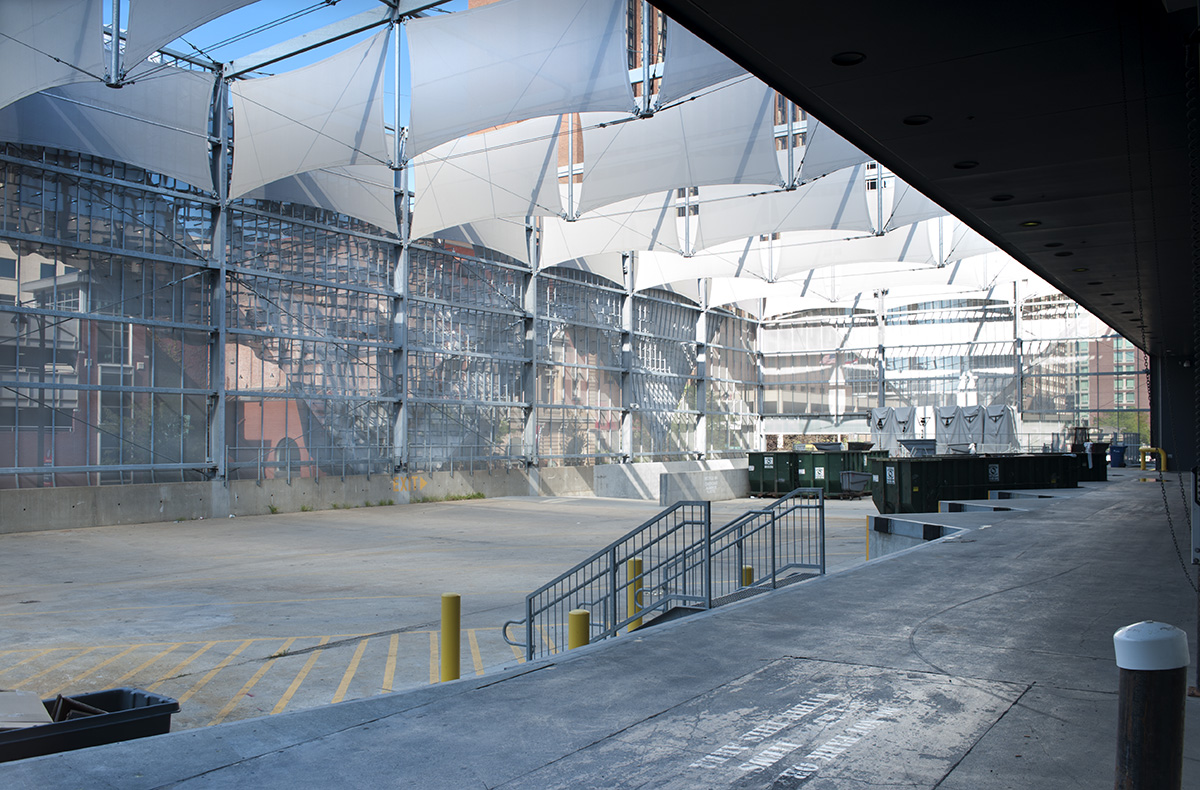 A view of the entire loading lot with the stretch panel facades lining the top.