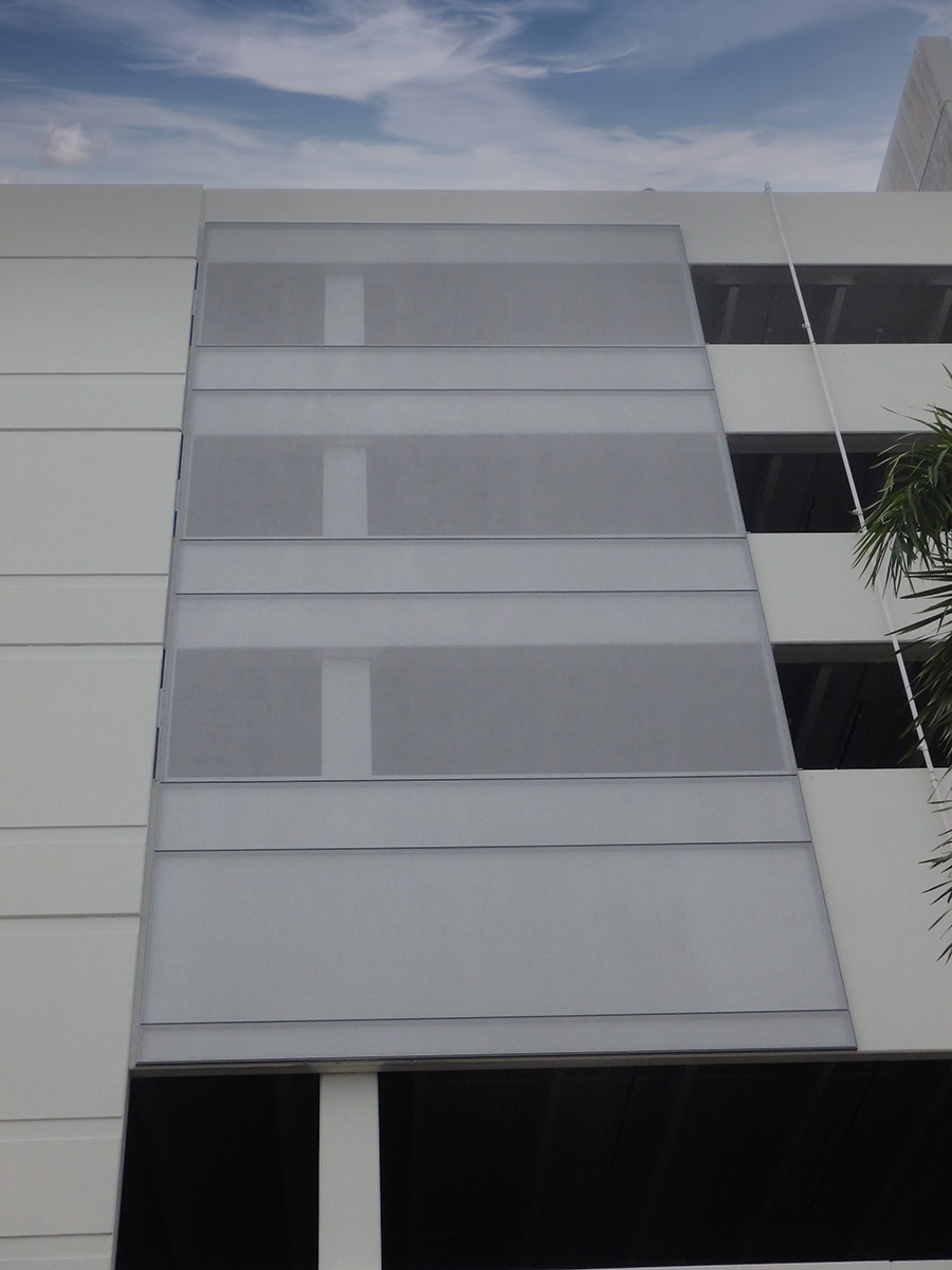 A sidewalk view of the facade.