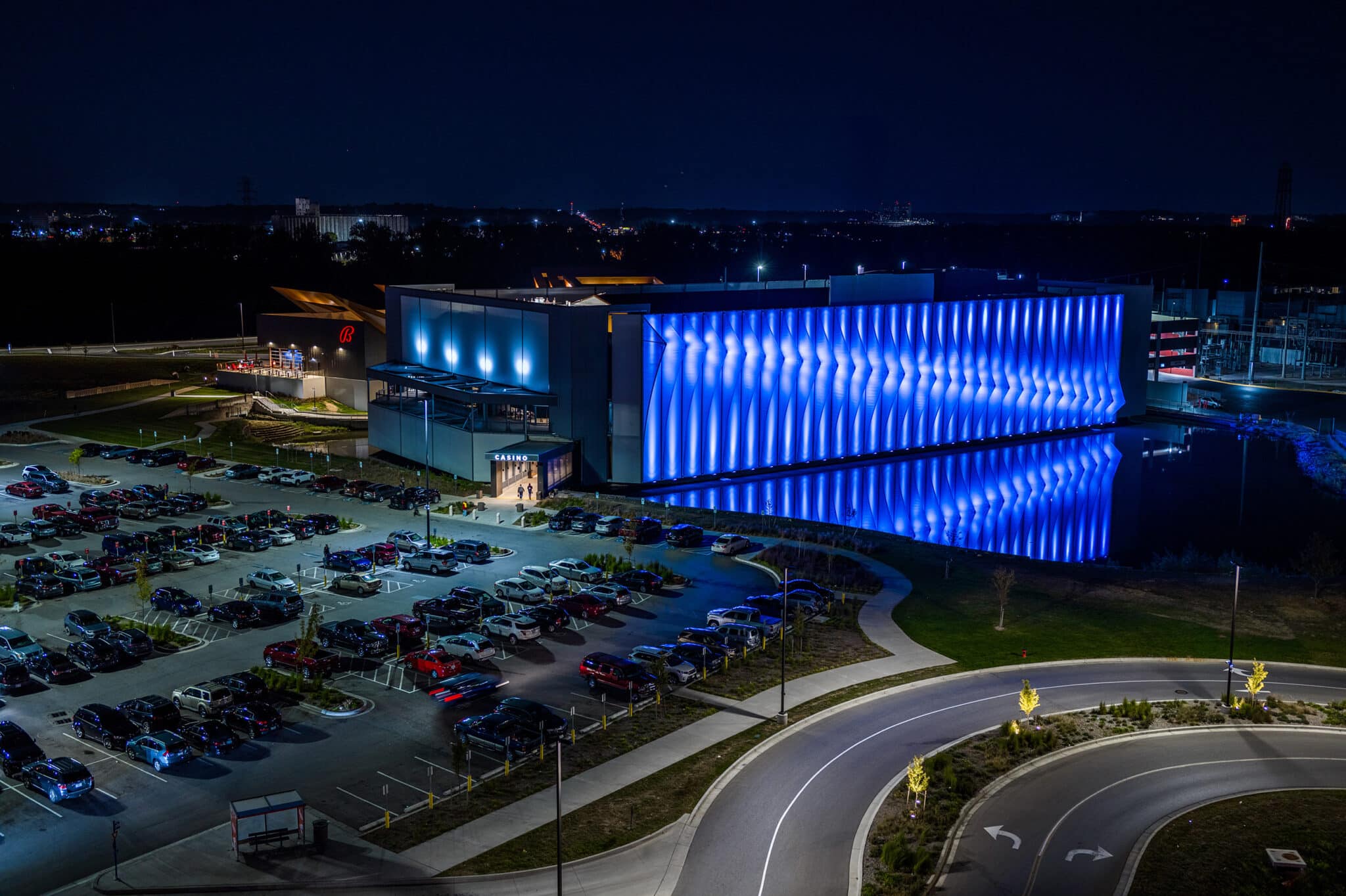 A night view of the facade showing the lights in two shades of blue showing that the colors can change and create different looks.