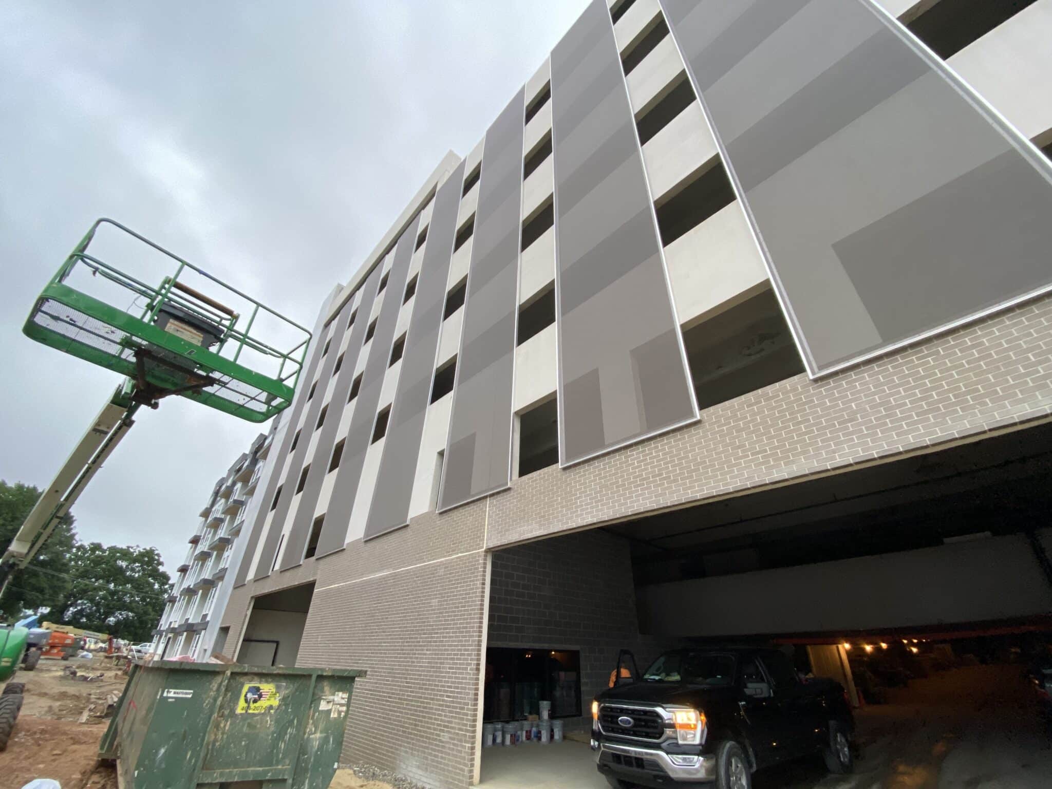 The parking facade viewed from the sidewalk.