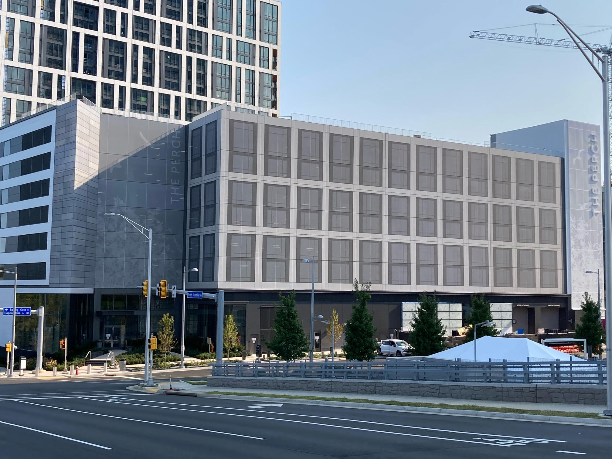 A wide shot of the facade from across the street.