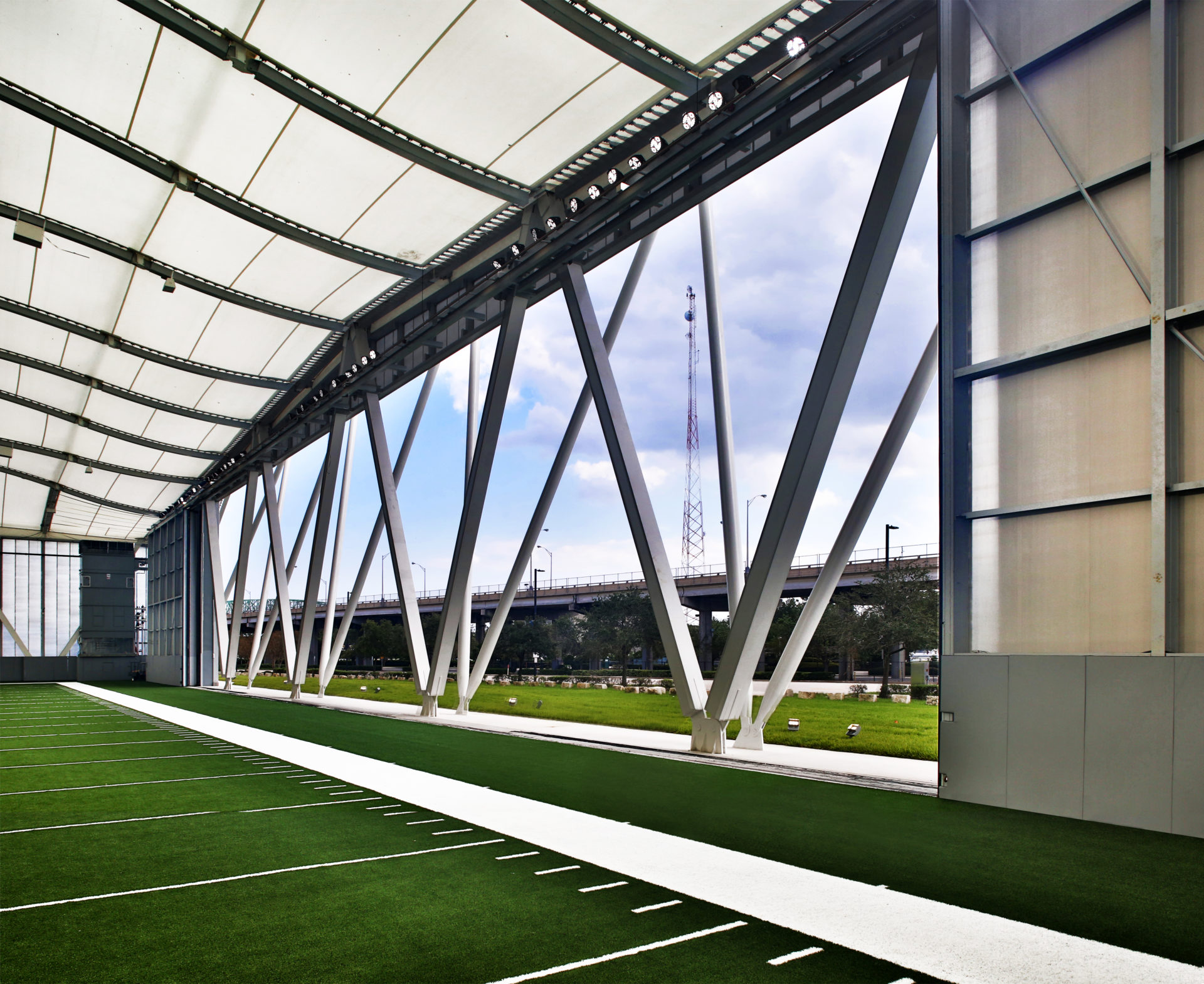 A view of the facade from the inside with the door open, looking out.