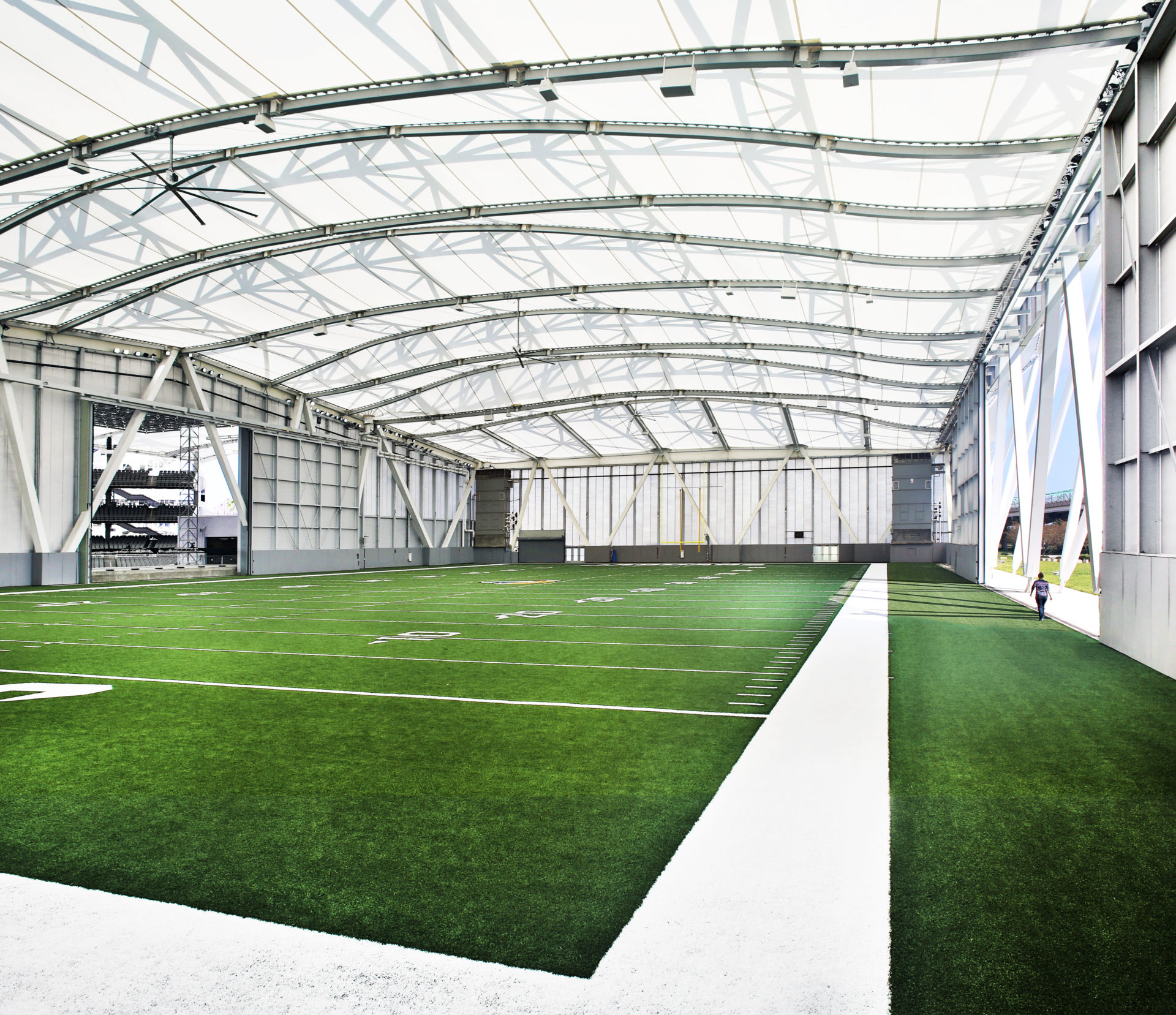 A view of the facade from inside showing it stretch the length of the football field.