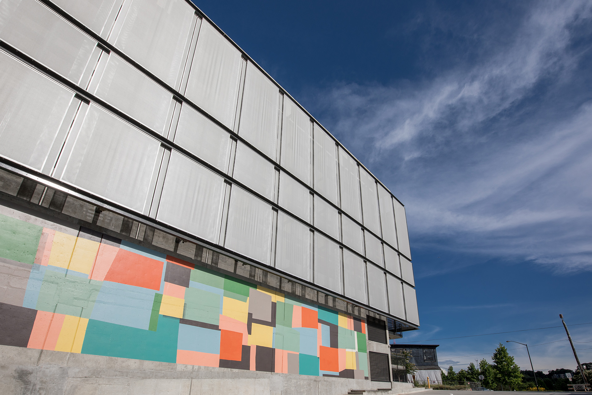 A view of the facade from the sidewalk.