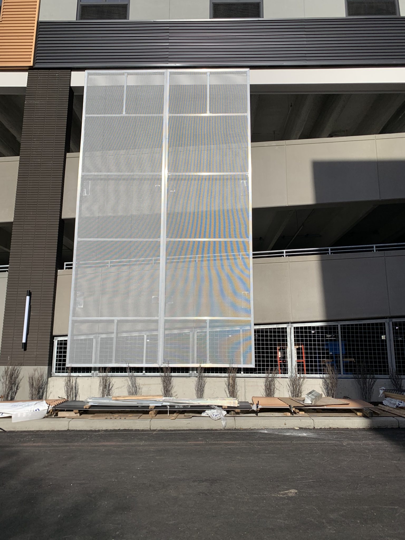 Close up of the metal facade before the graphic component was installed.
