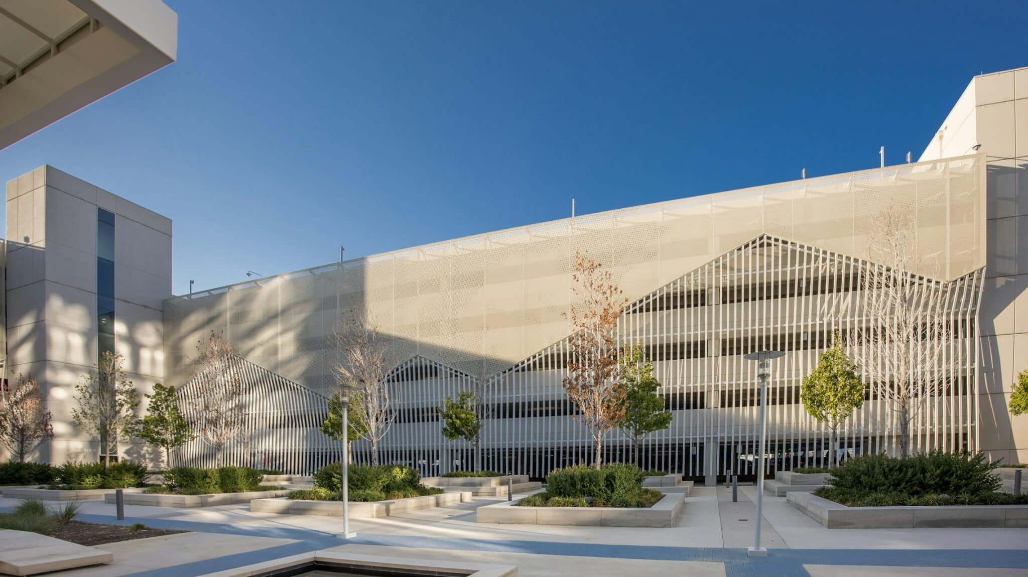 A wide view of the facade showing the entirety of the mountainous inspiration of the facade.