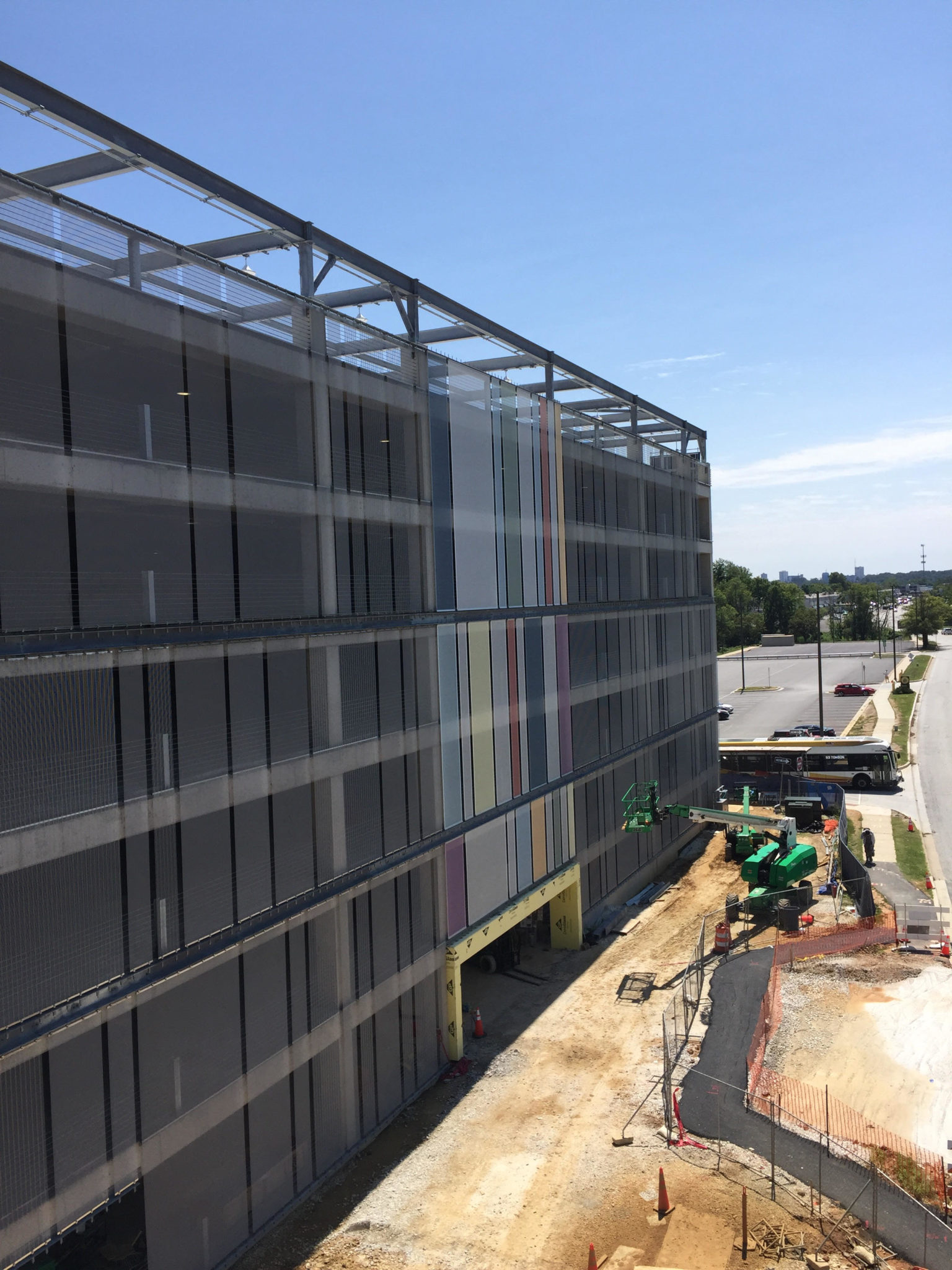 Another view of the colorful portion of the facade, sandwiched between plain grey facades.