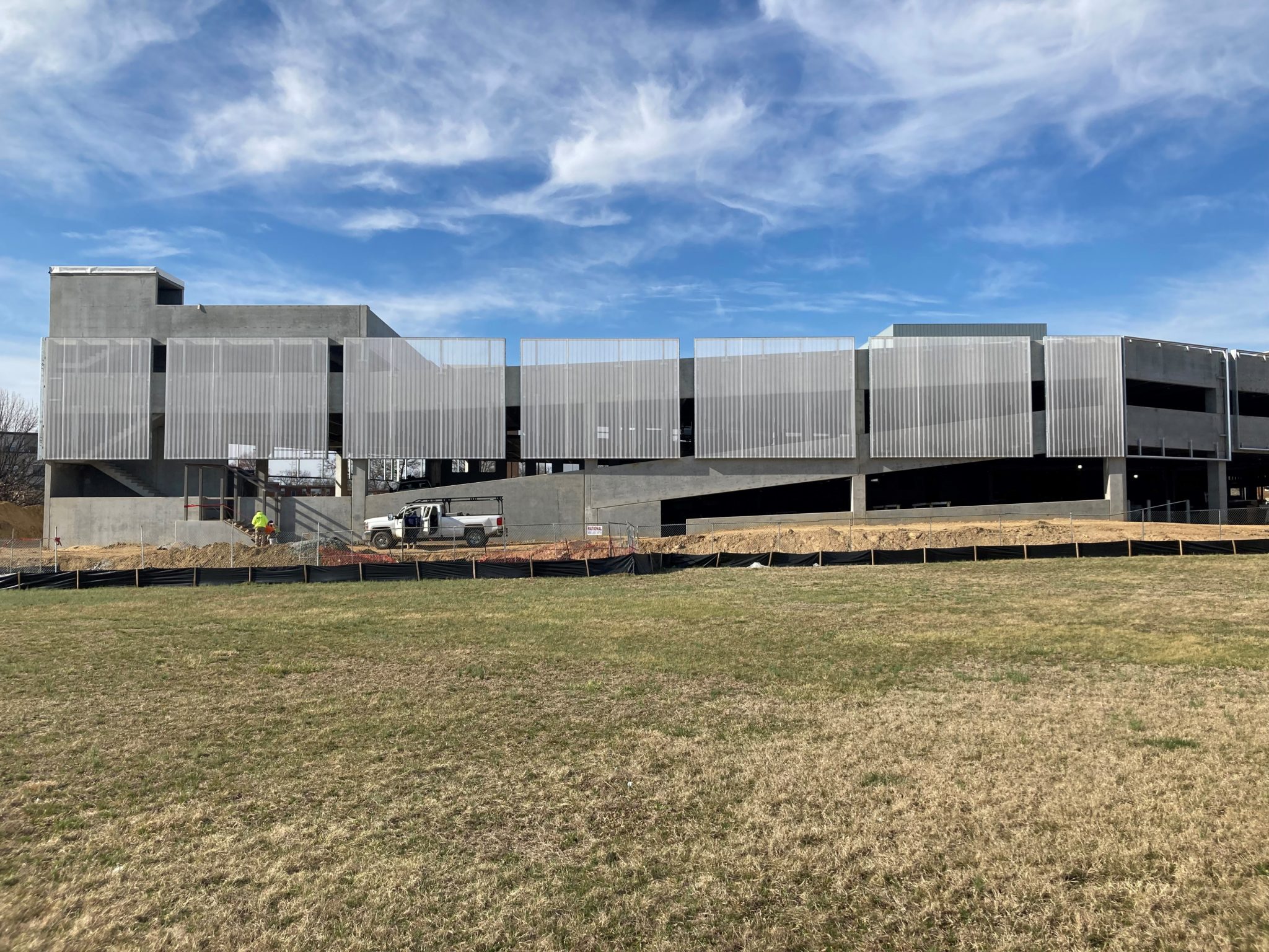 A simplistic, opaque Ventilated PES Cladding facade on a steel structure.