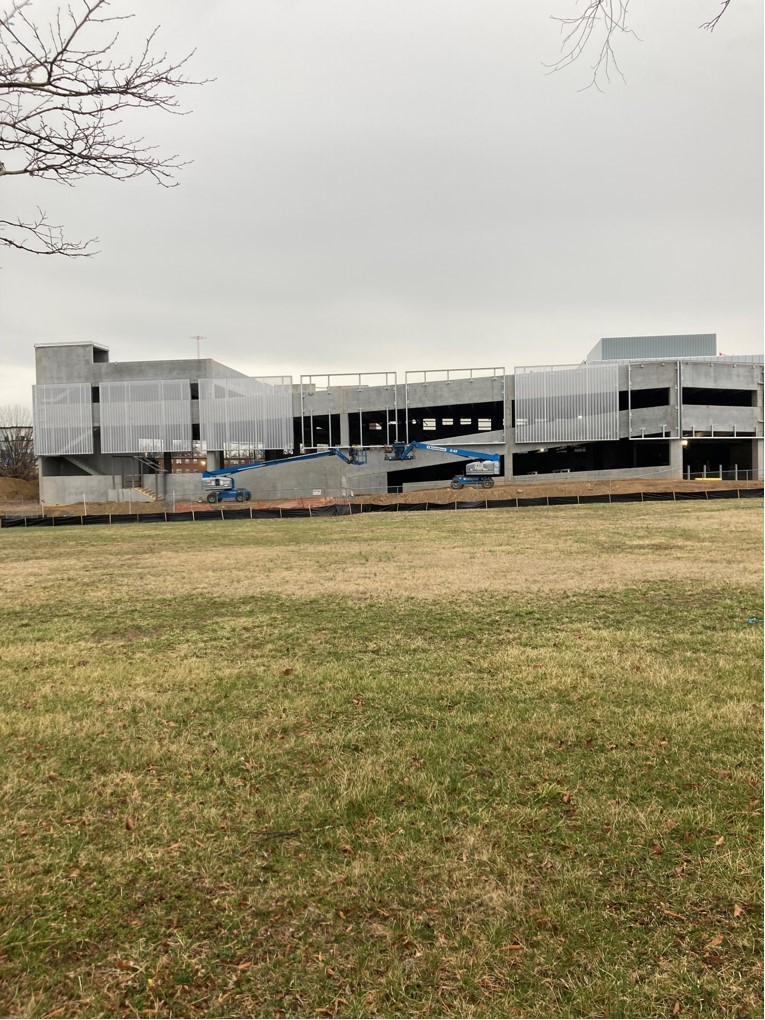 Process photos of the facade being installed.