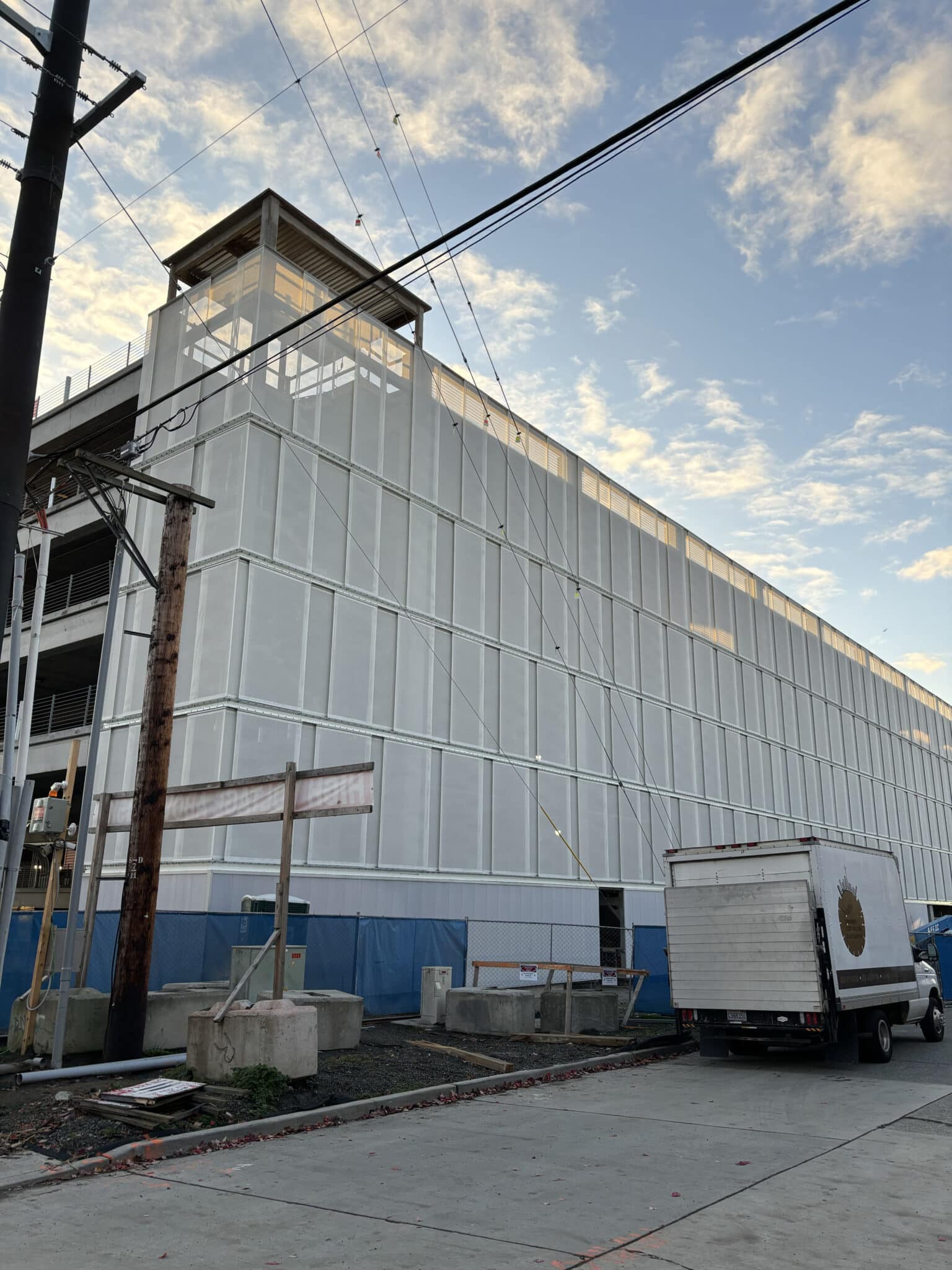 Process photos of the facade being installed.