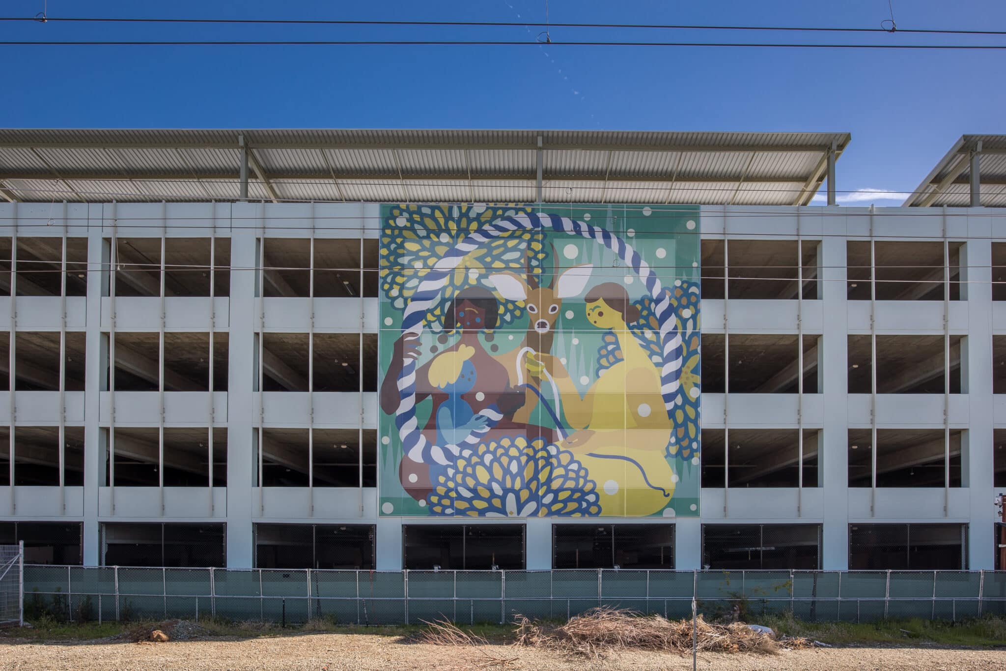 One of the artistic facades featuring humans and animal sat together, implying harmony between species.