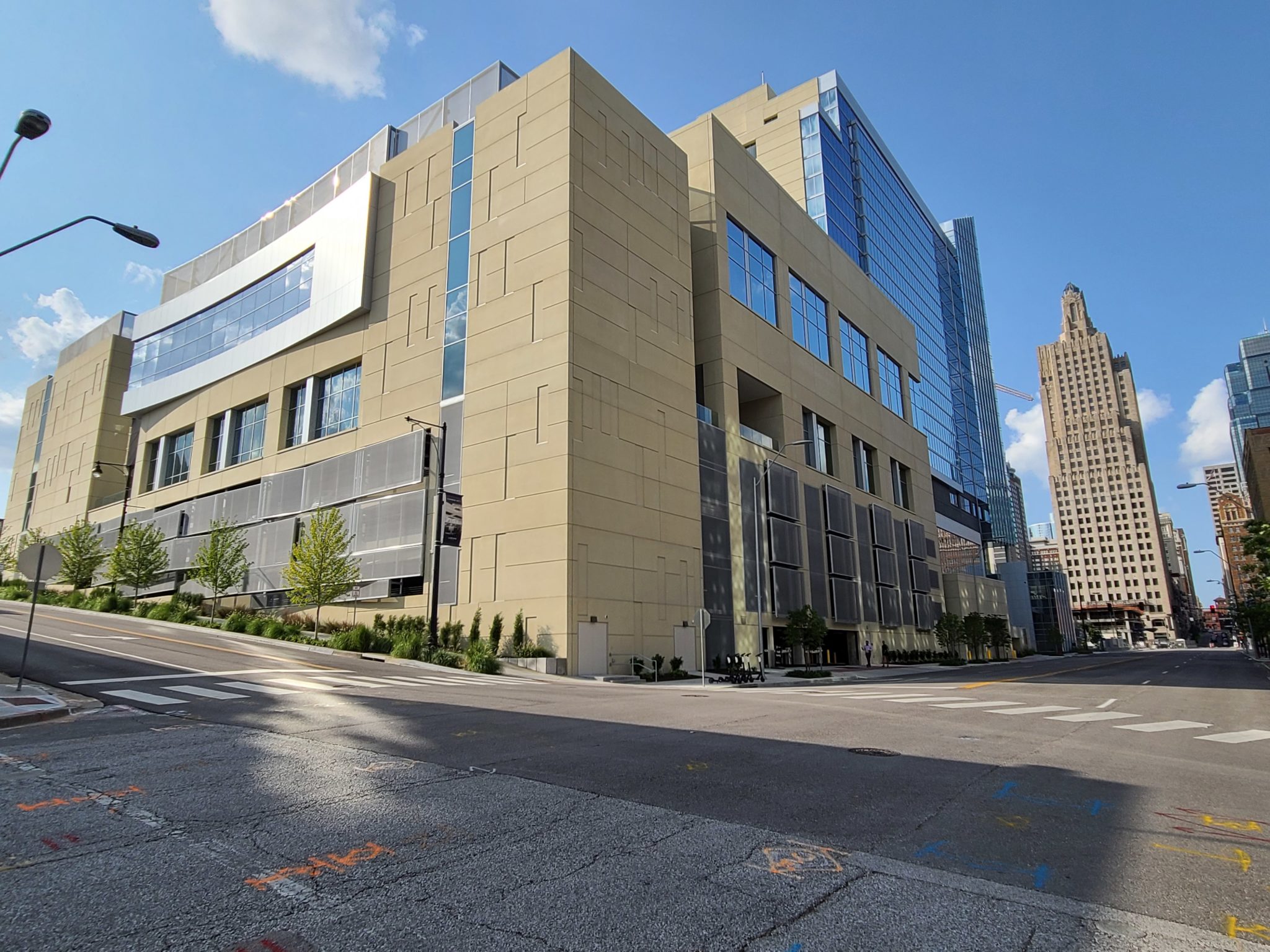 A view of the entire hotel that shows the metal parking structure that swoops out to allow for ventilation.