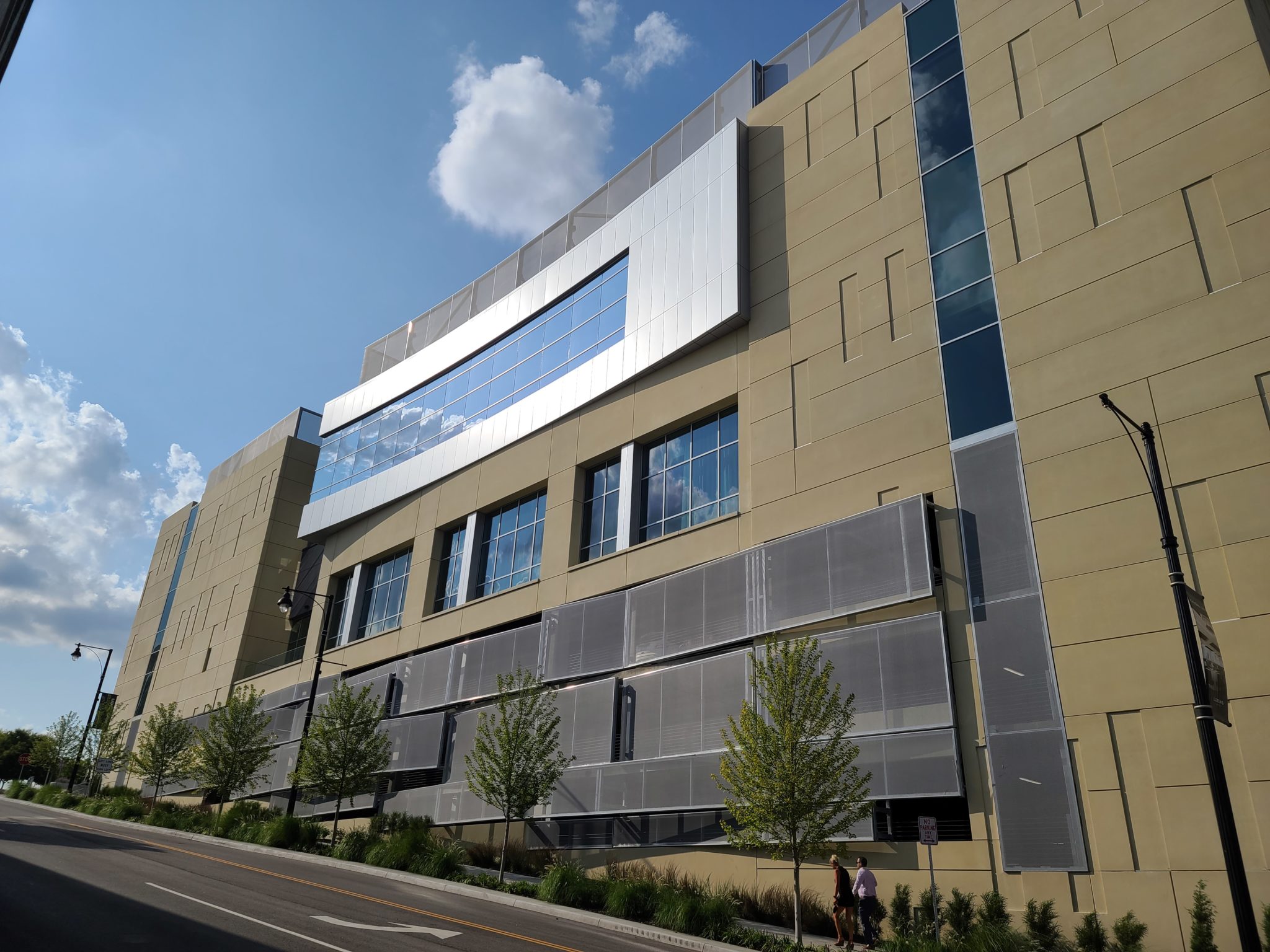 A street view of the swooping side of the facade.