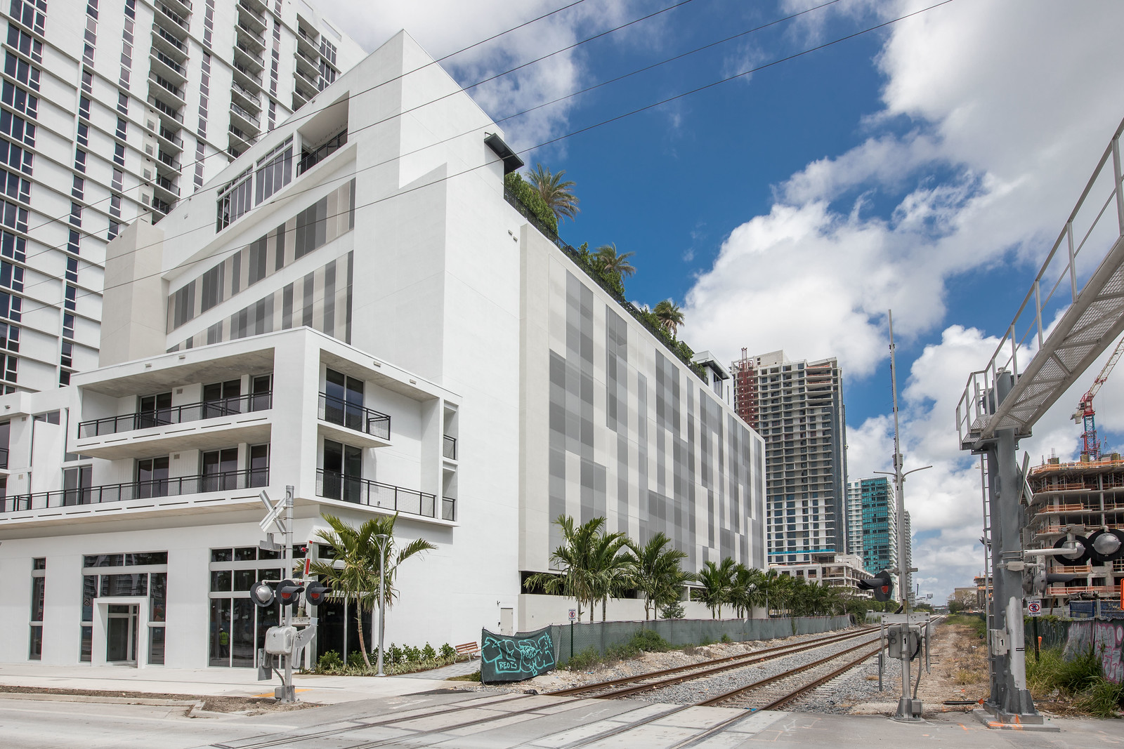 A wide view of the parking structure showing the facade in context.
