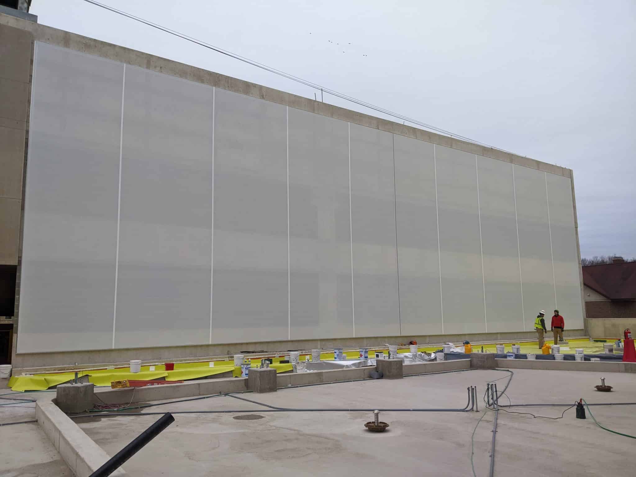 A wide shot of the full flat white facade.