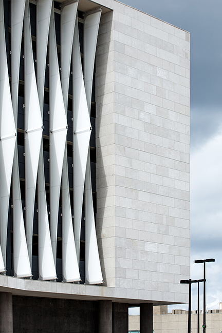 A view of the fins sticking out against the light material of the buildings structure.