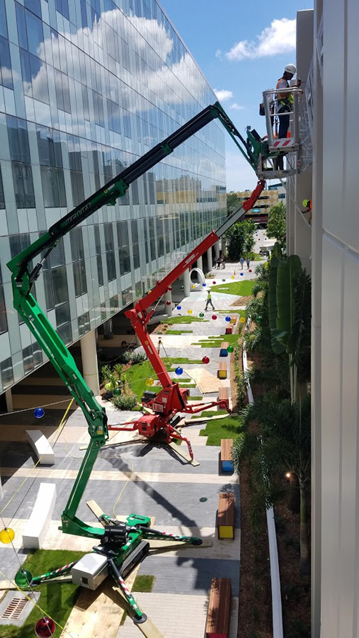 Process photo of the facade being installed.