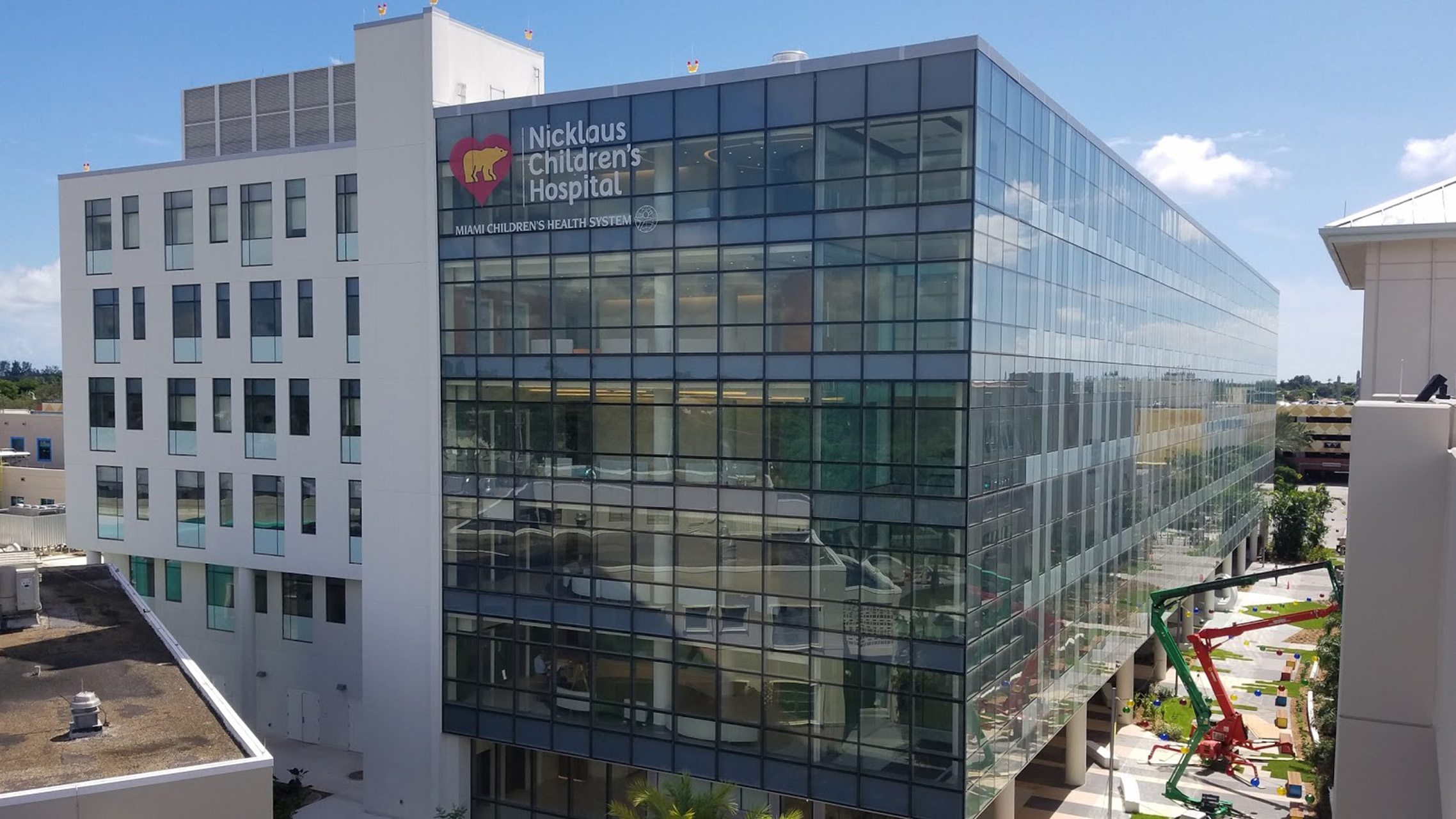 Process photo of the facade being installed.