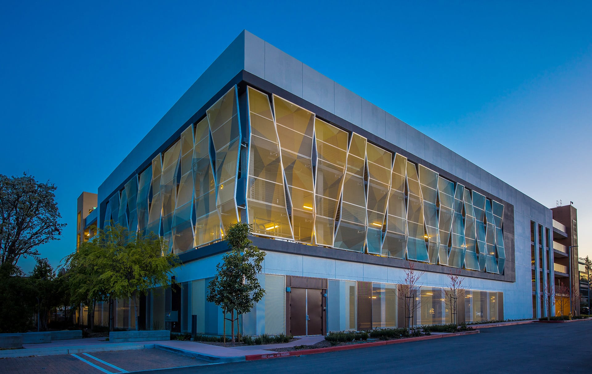 A view of the facade wrapped around a corner sitting on two sides of the structure.