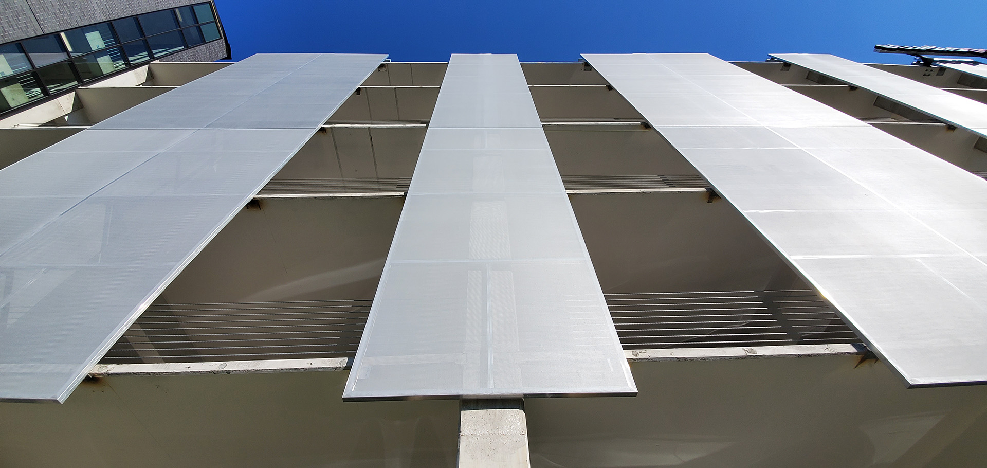 A view from the sidewalk showing the thickness of the facade panels.