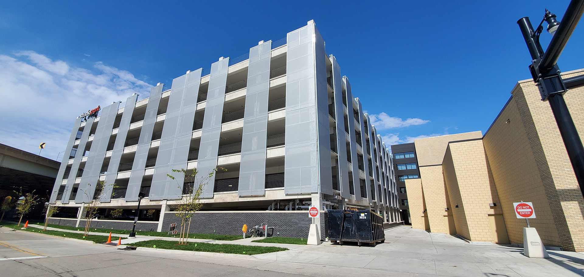 A view of the corner of the parking structure showing how the facade panels are on all sides.