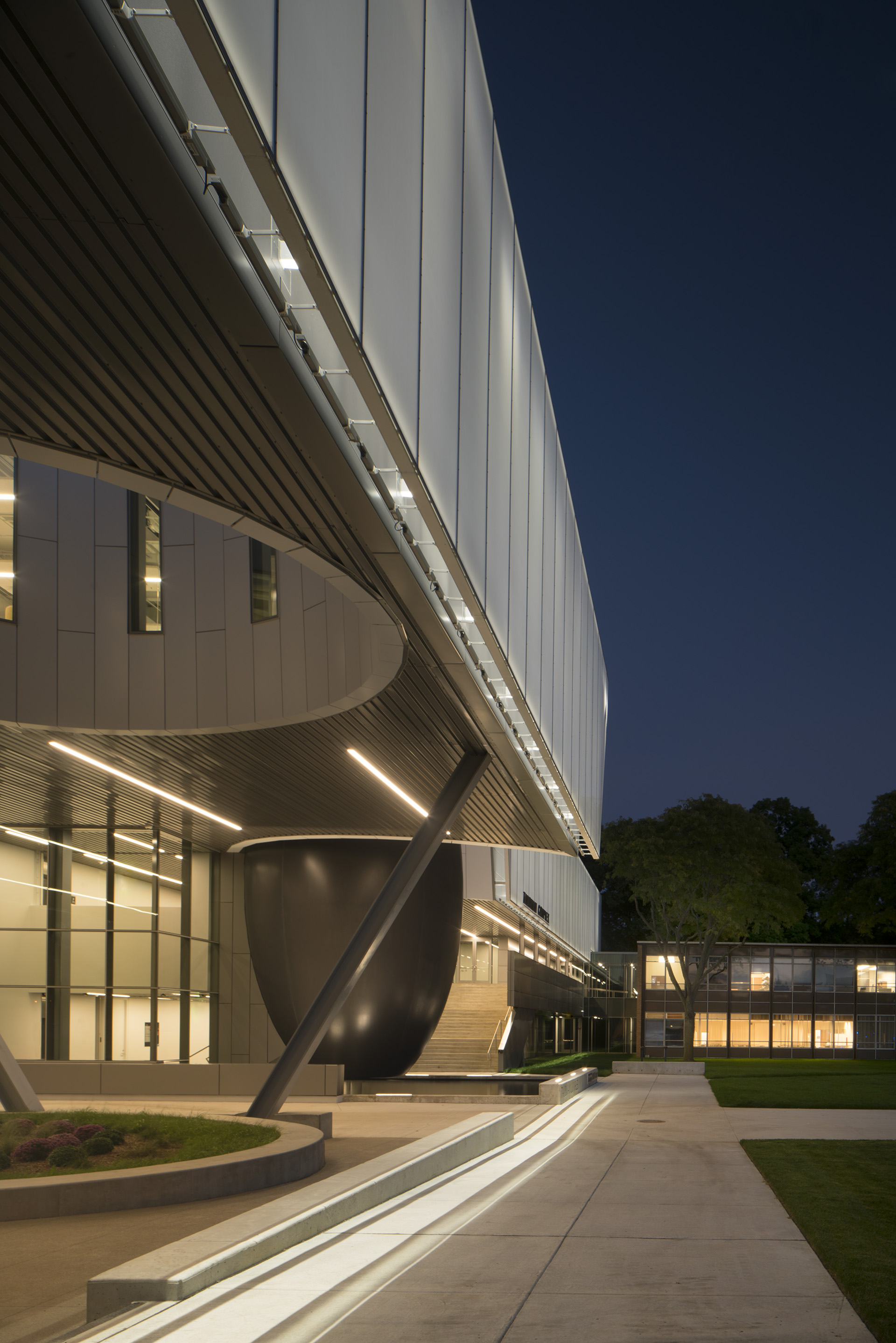 A shot showing the facade in context with the entrance area.