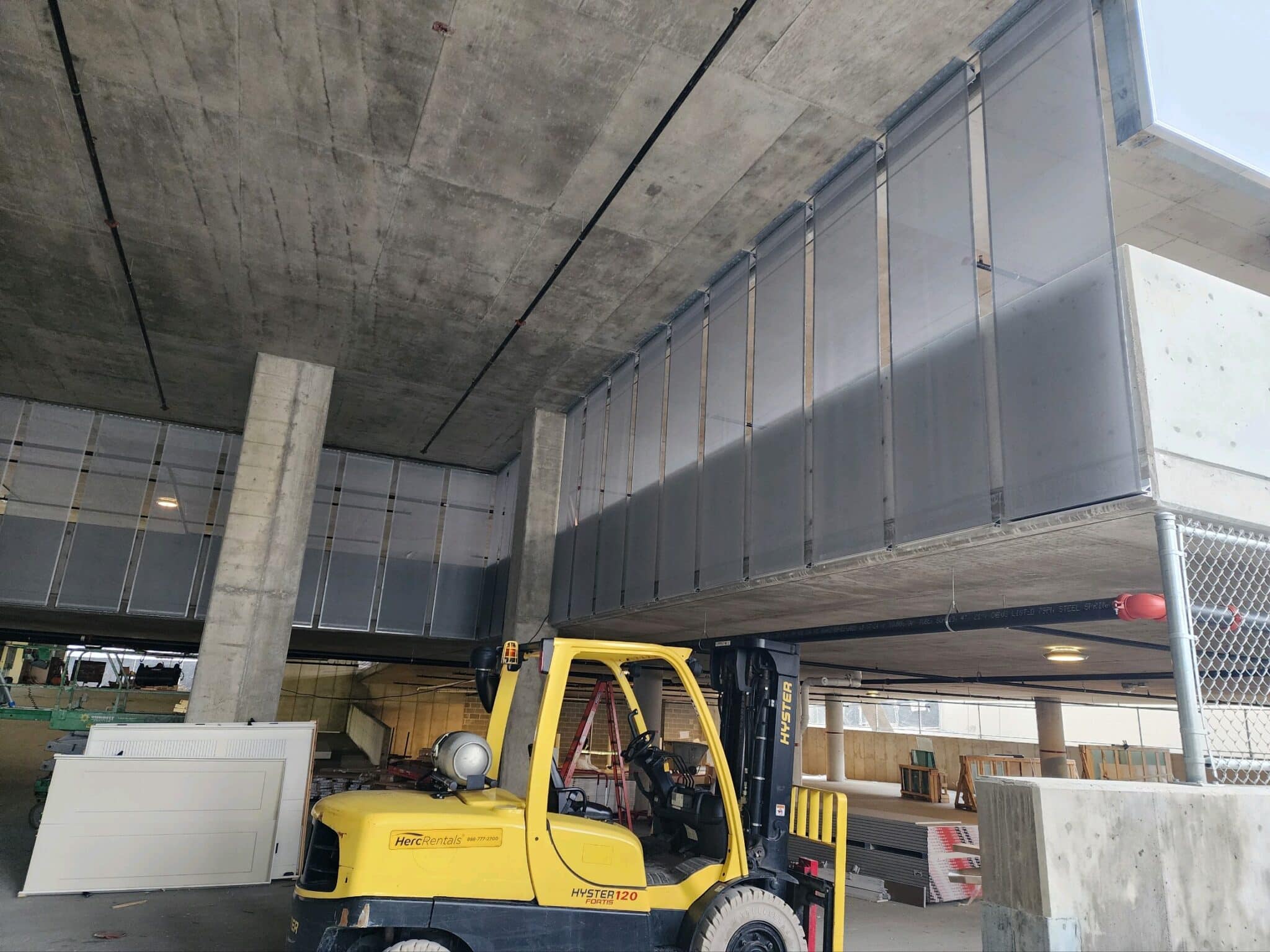 Process photos of the facade being installed