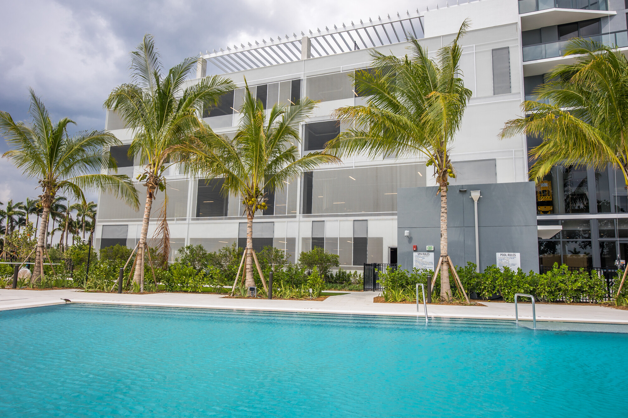 Black and gray facade panels stretching across a parking structure.