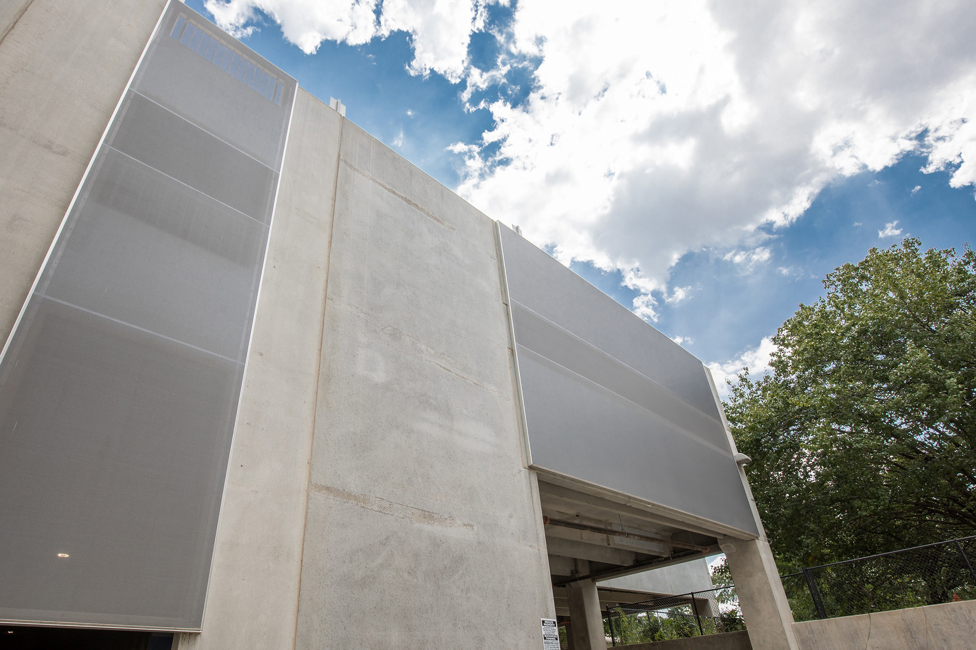 A view from the sidewalk looking up at the facade.