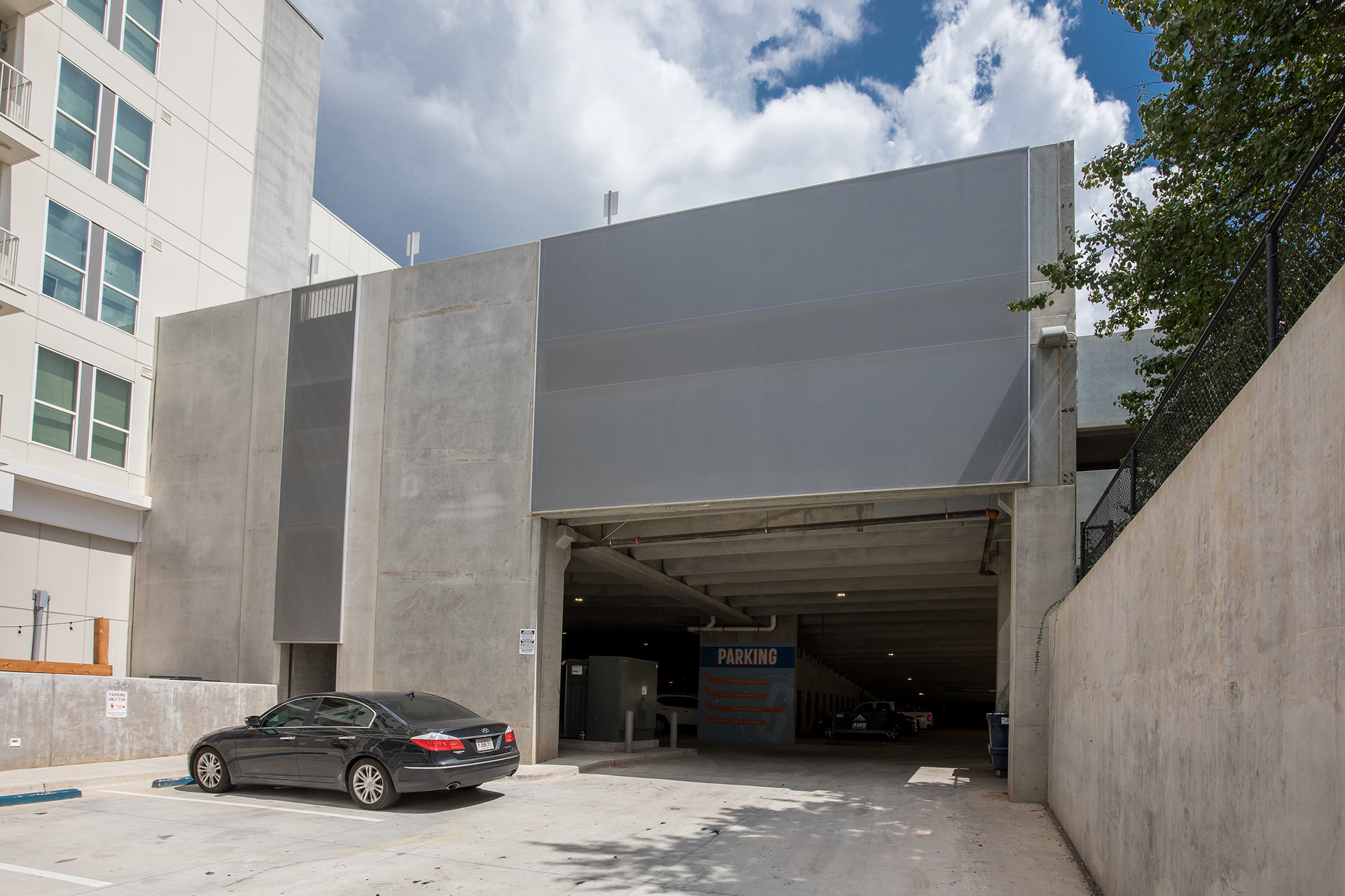 A view of the facade from the top of the parking garage.