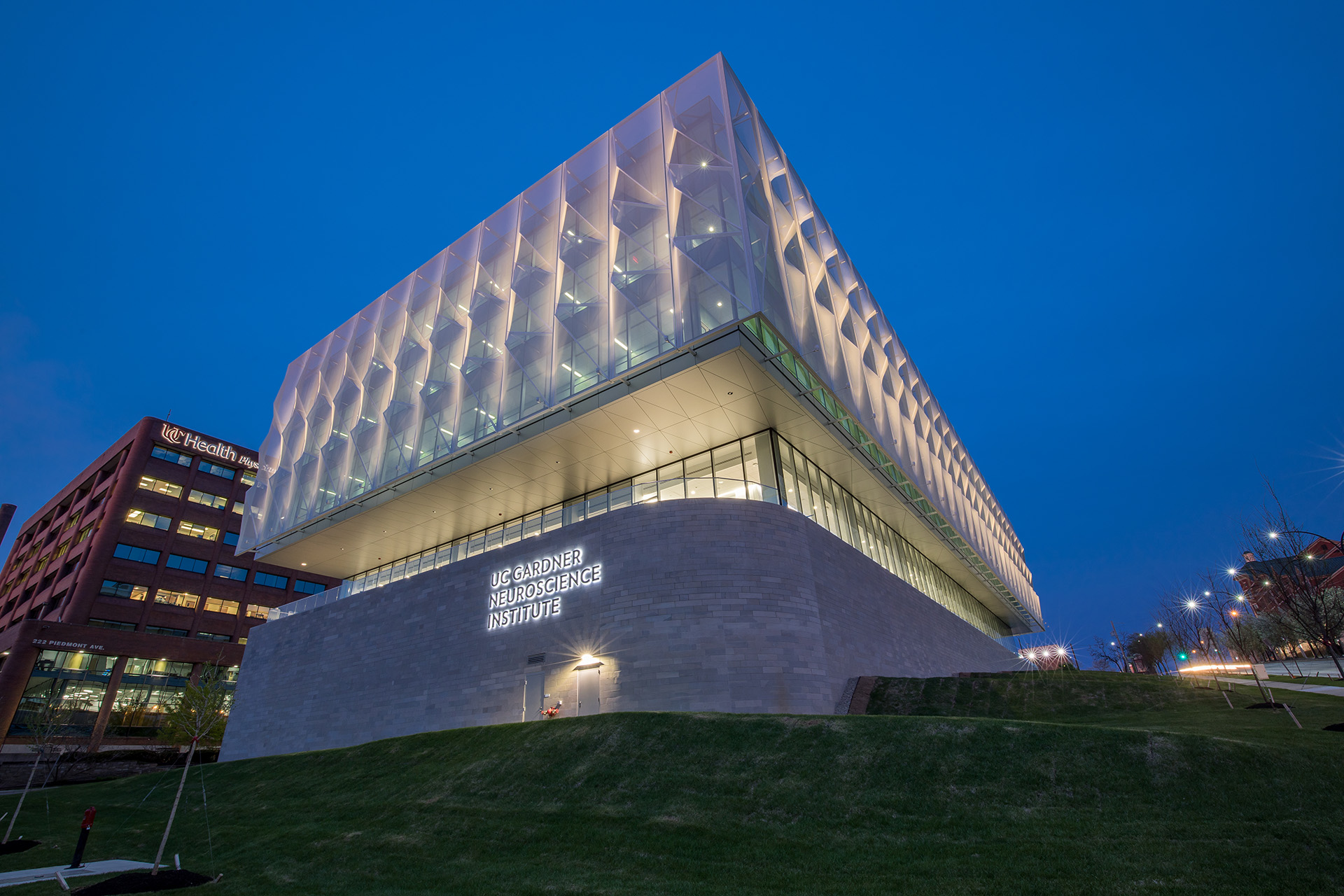 Another view of the facade at night with the light shining through.