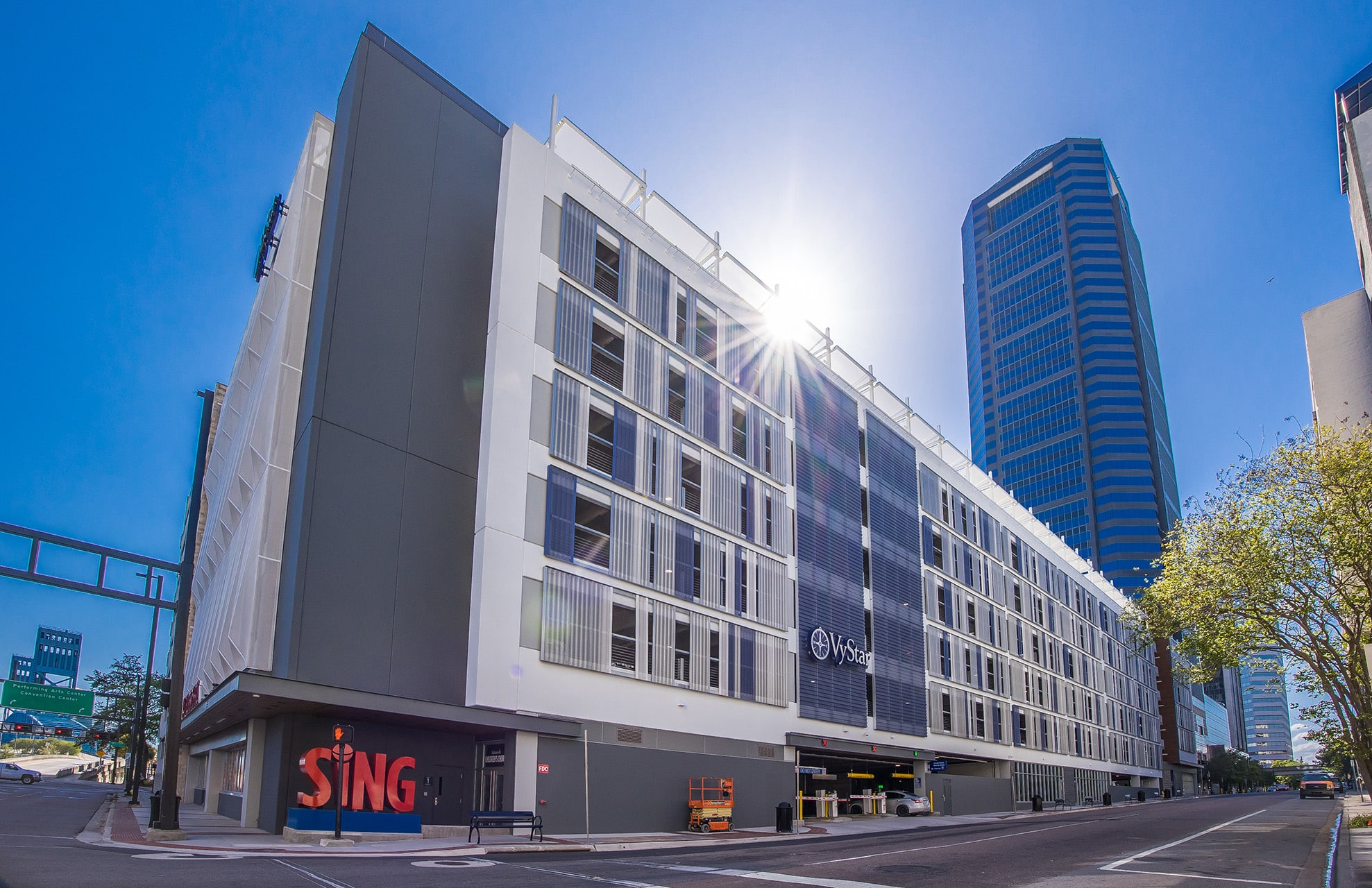 A view of a blue and white slotted facade that sits on a different side of the structure.