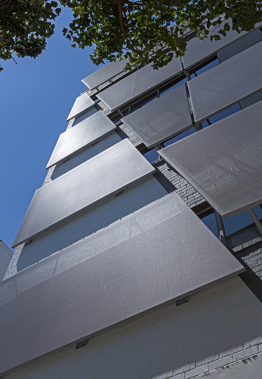 Another view of the facade from the sidewalk.