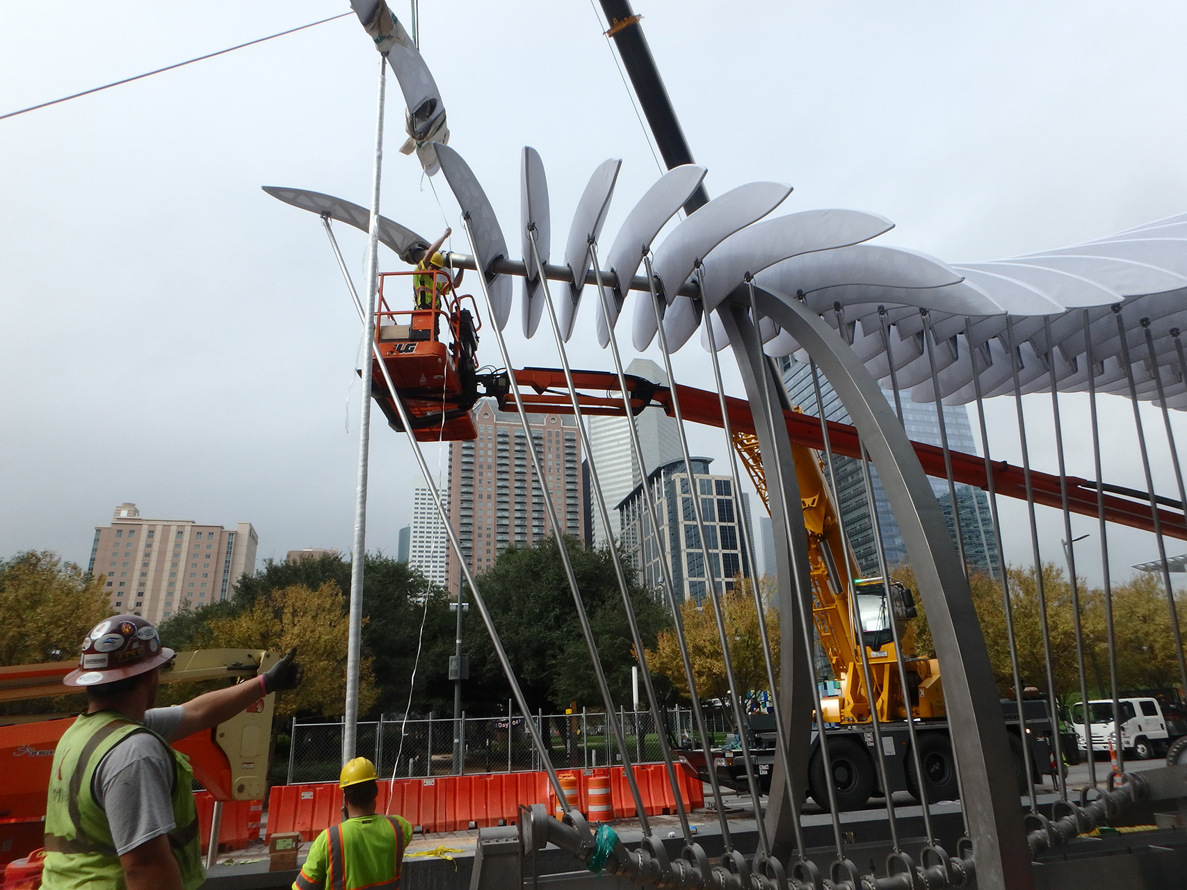 Process photos of the sculpture being installed.