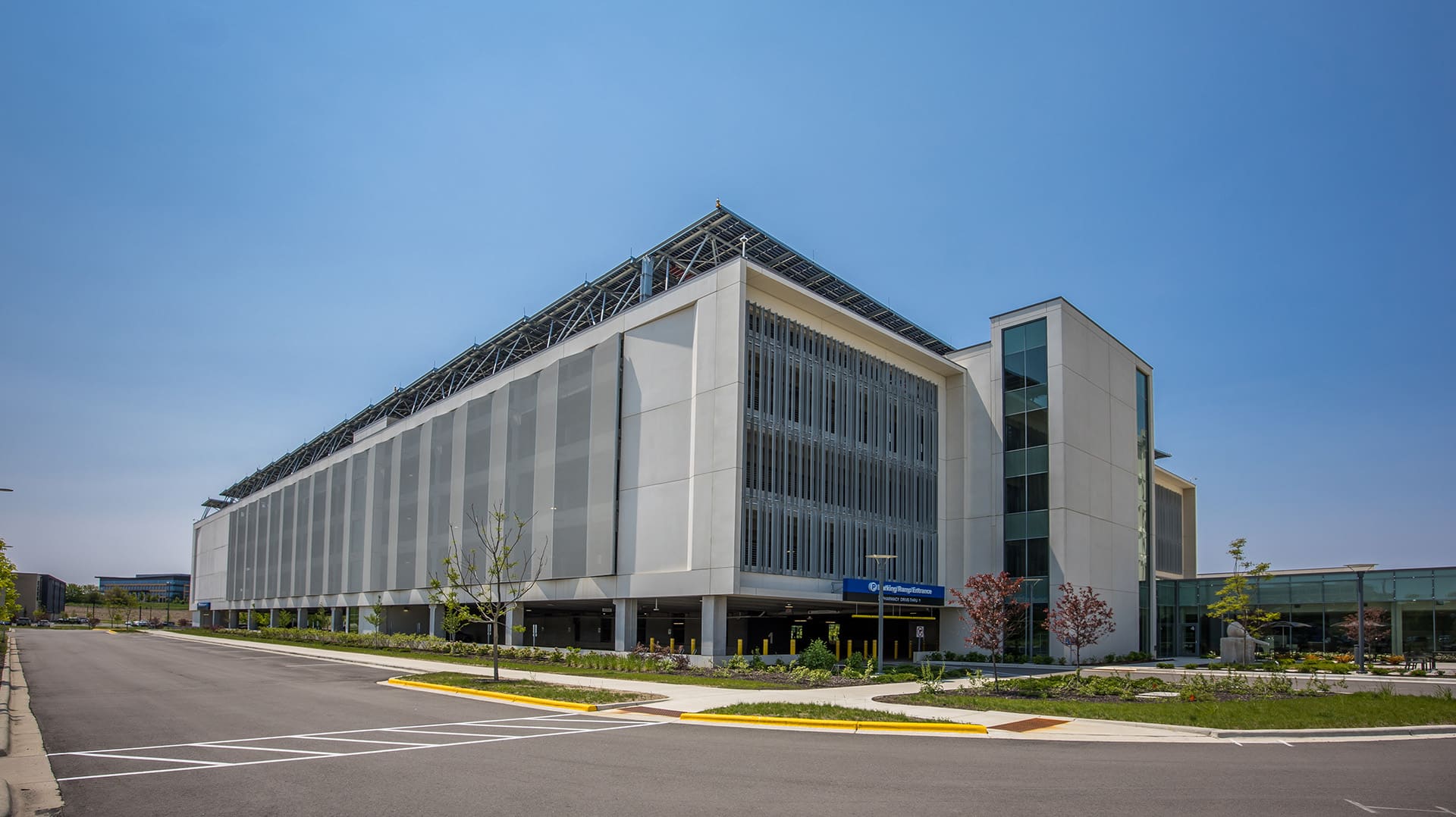 A simple grey facade where each panel sits at an angle creating a chevron like pattern.