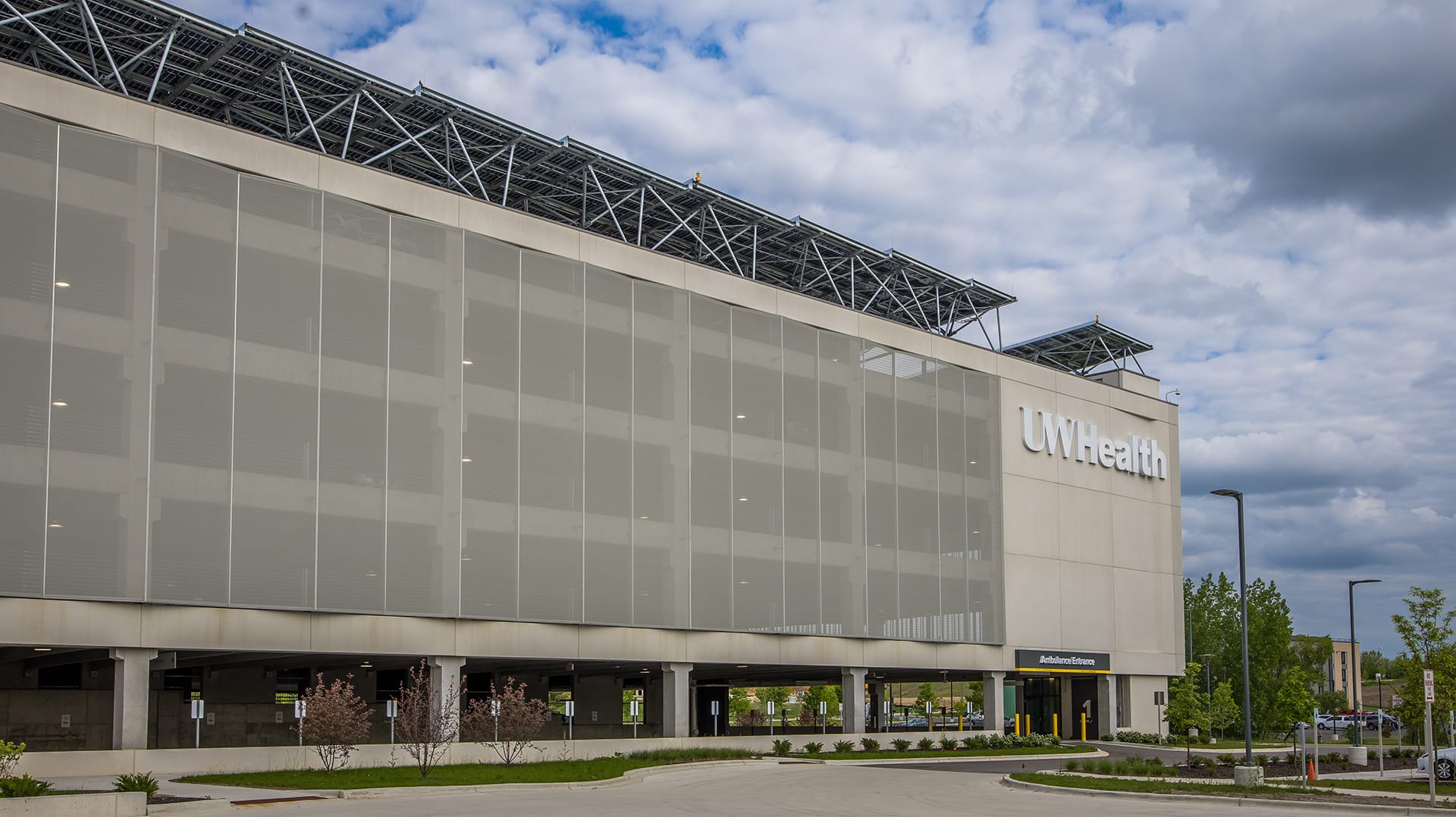 A view showing the facade next to the company branding, highlighting how it draws your attention to the branding rather than the large structure.