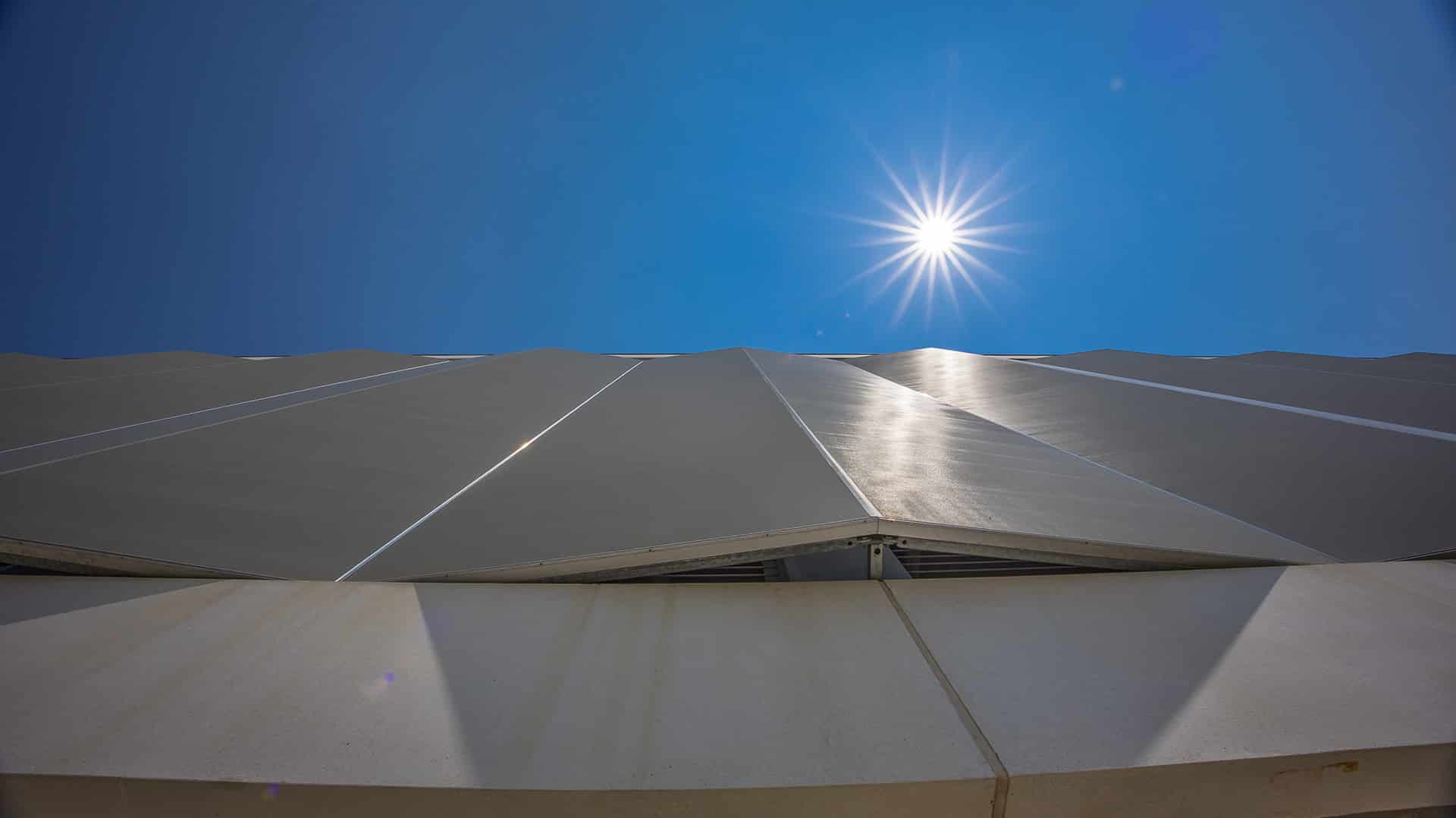 A view from the sidewalk showing the slight angle of the facade panels.