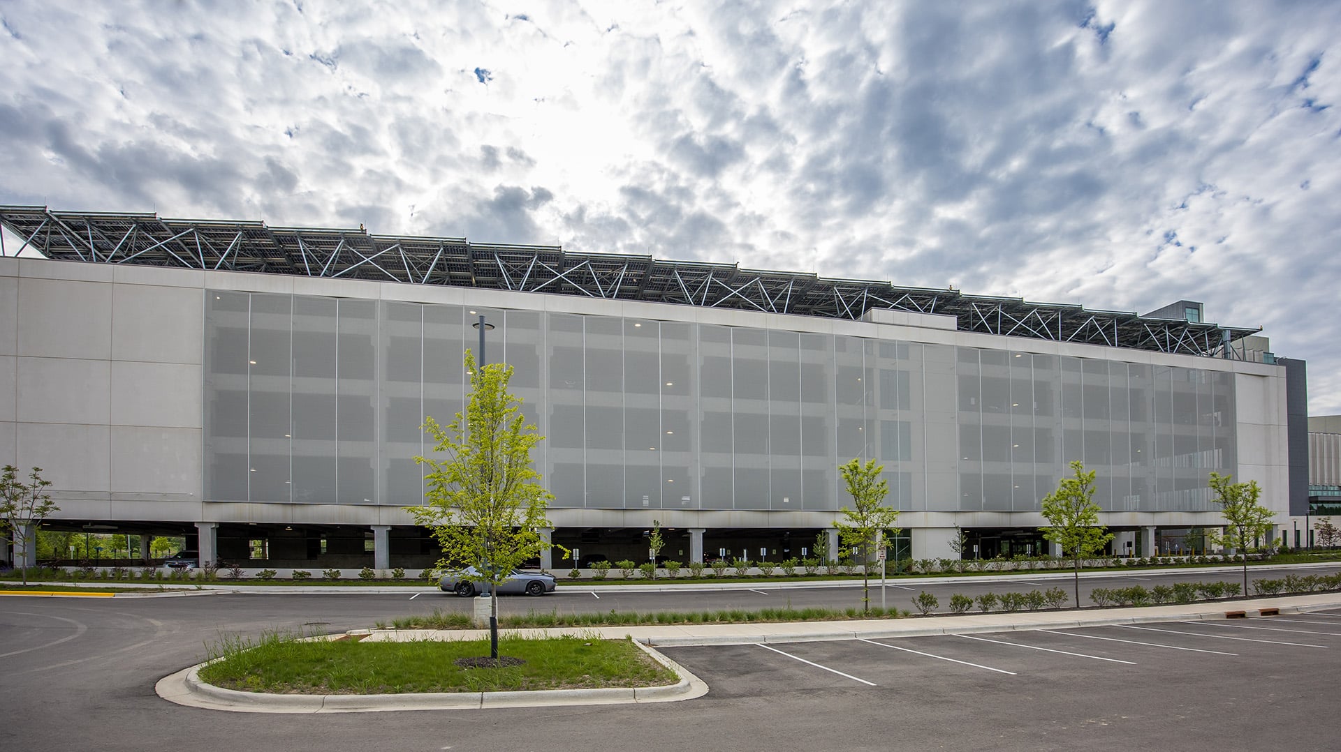 A wide view shot of the entire parking structure, showing how the facade fits in context.