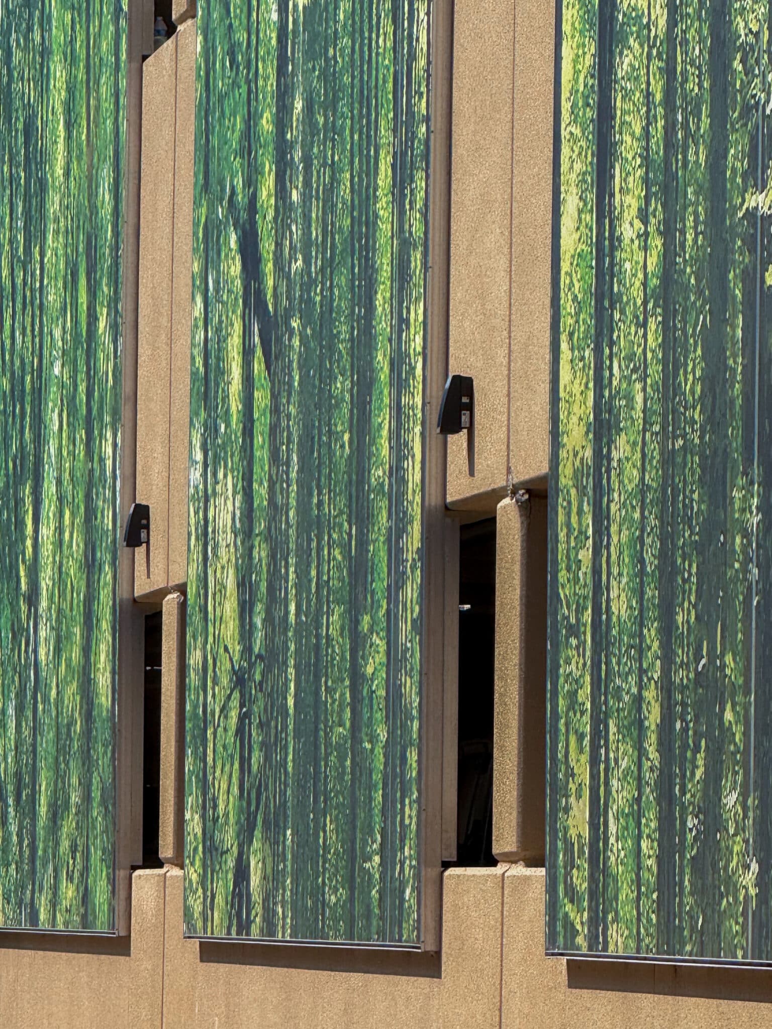 A wider view of the facade showing multiple panels.