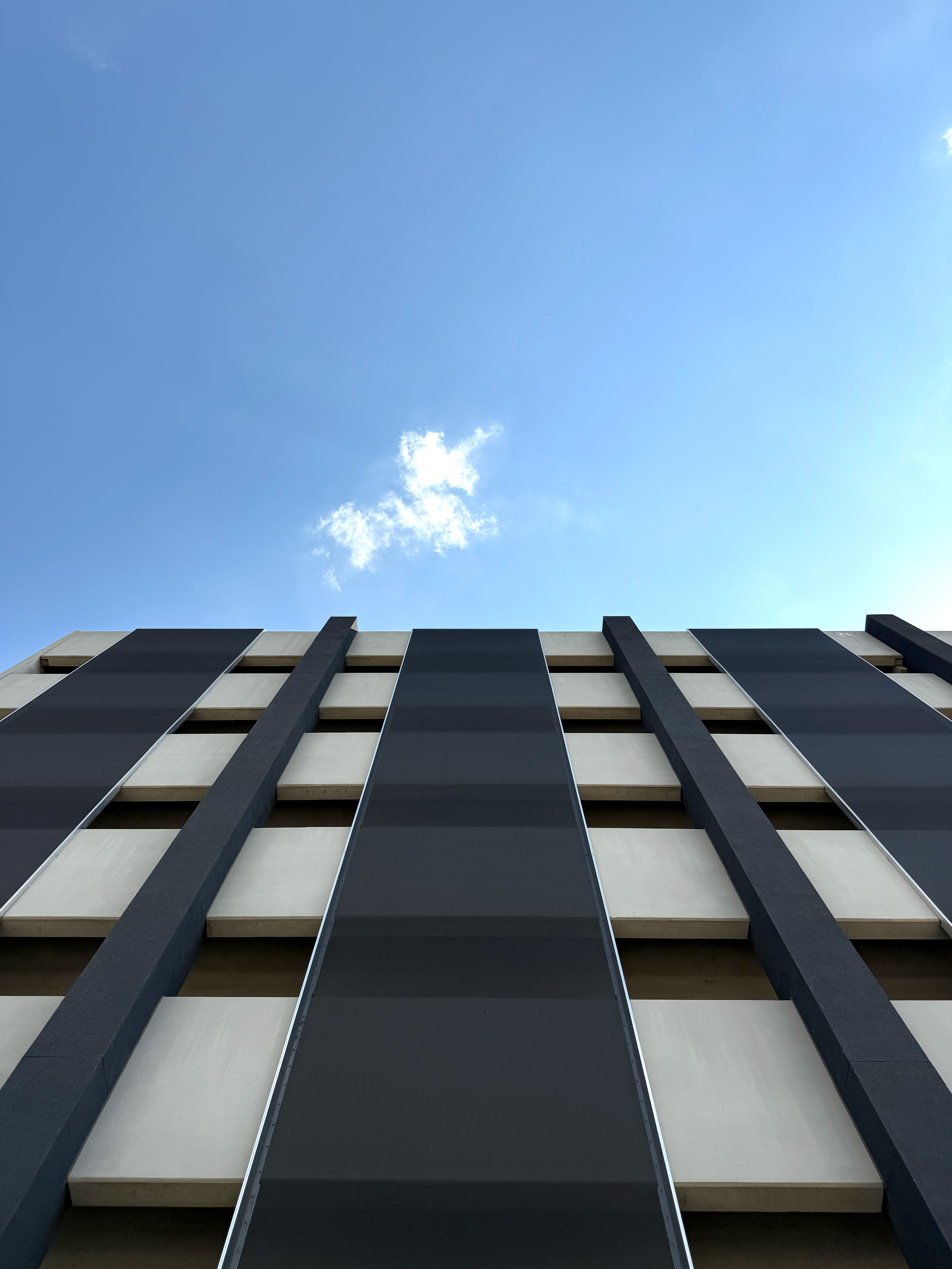 A view of the facade panels from the sidewalk.