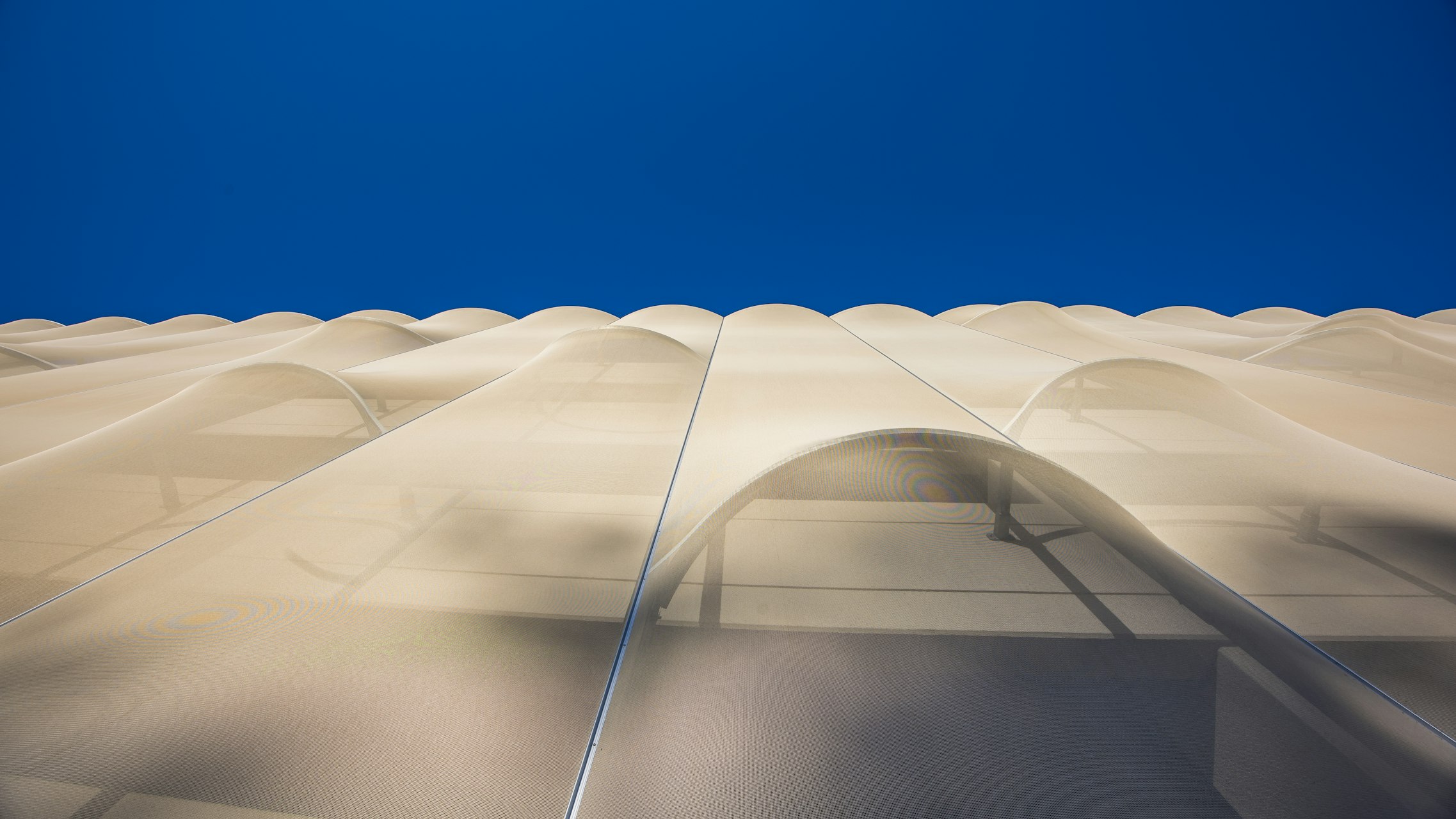 A shot of the facade looking up from the sidewalk.
