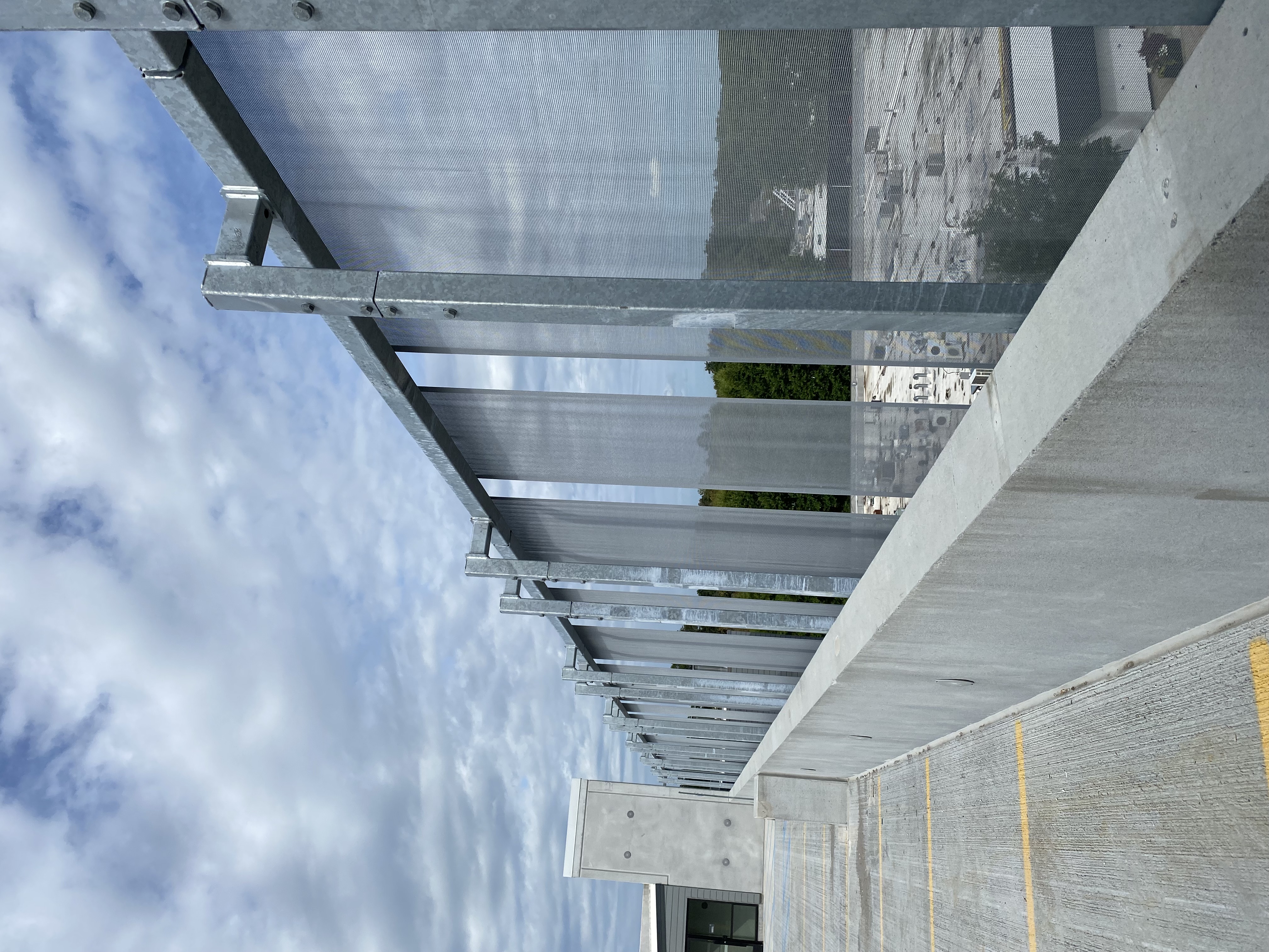 A view from inside of the parking garage, showcasing how the facade still provides a clear view out to the surrounding area.