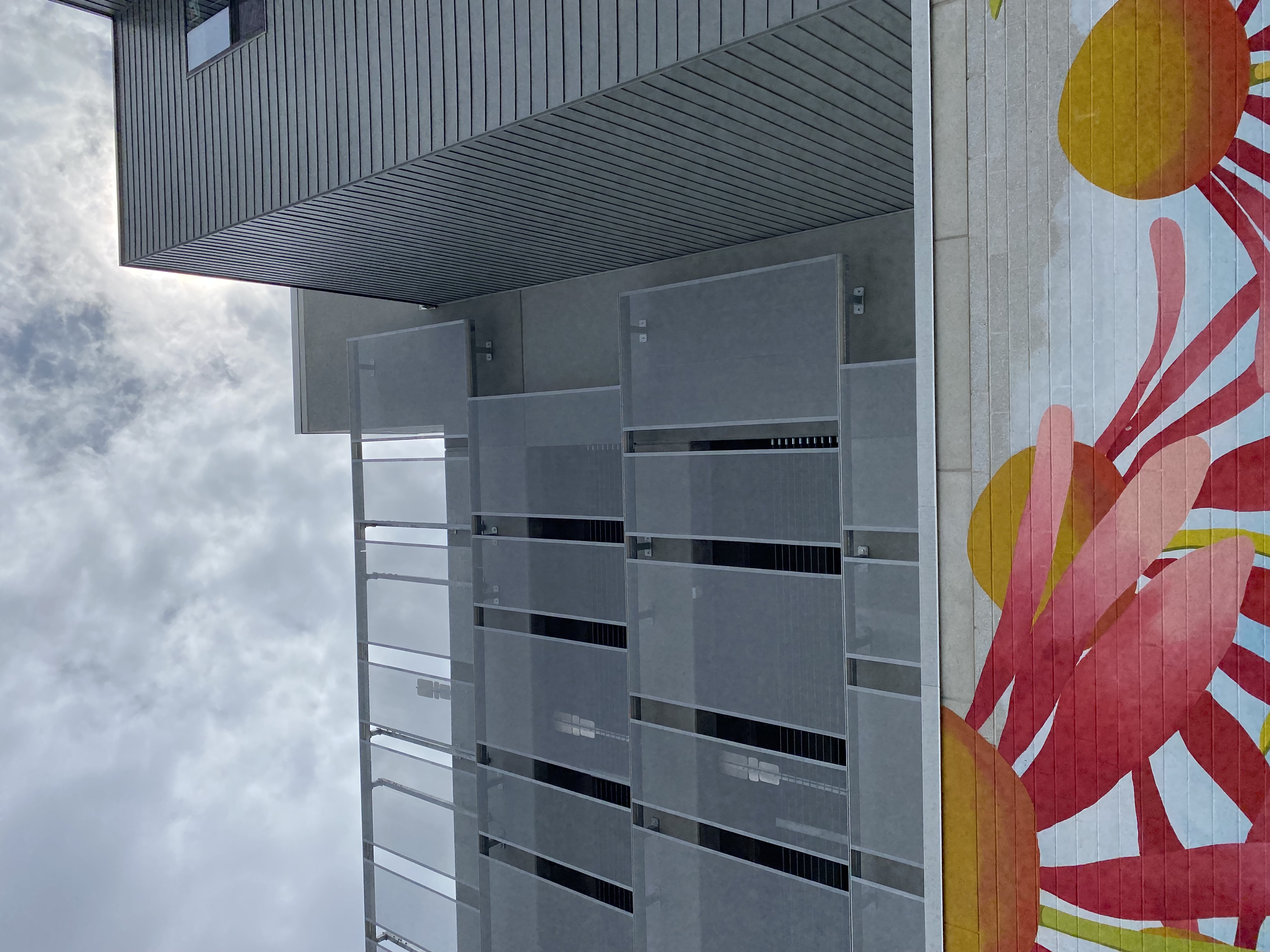 A sidewalk view of the slotted facade.