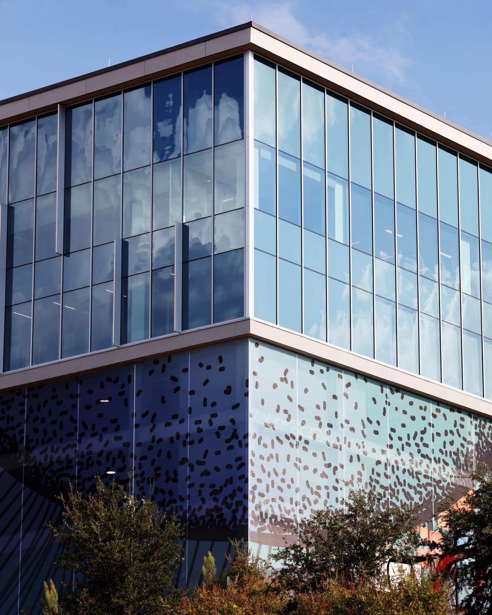 A corner spot of a blue space like facade that features a pointillism style section.